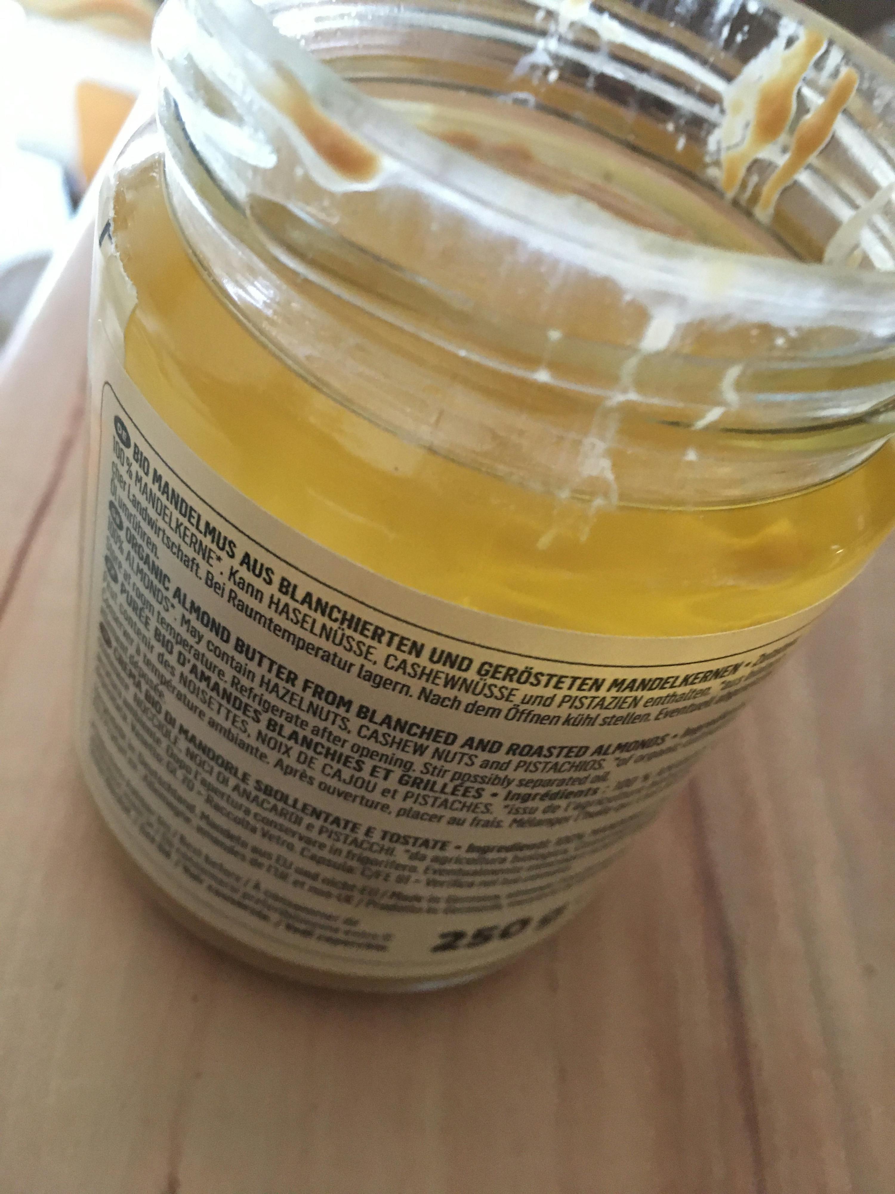 a jar of peanut butter with foreign writing on the label