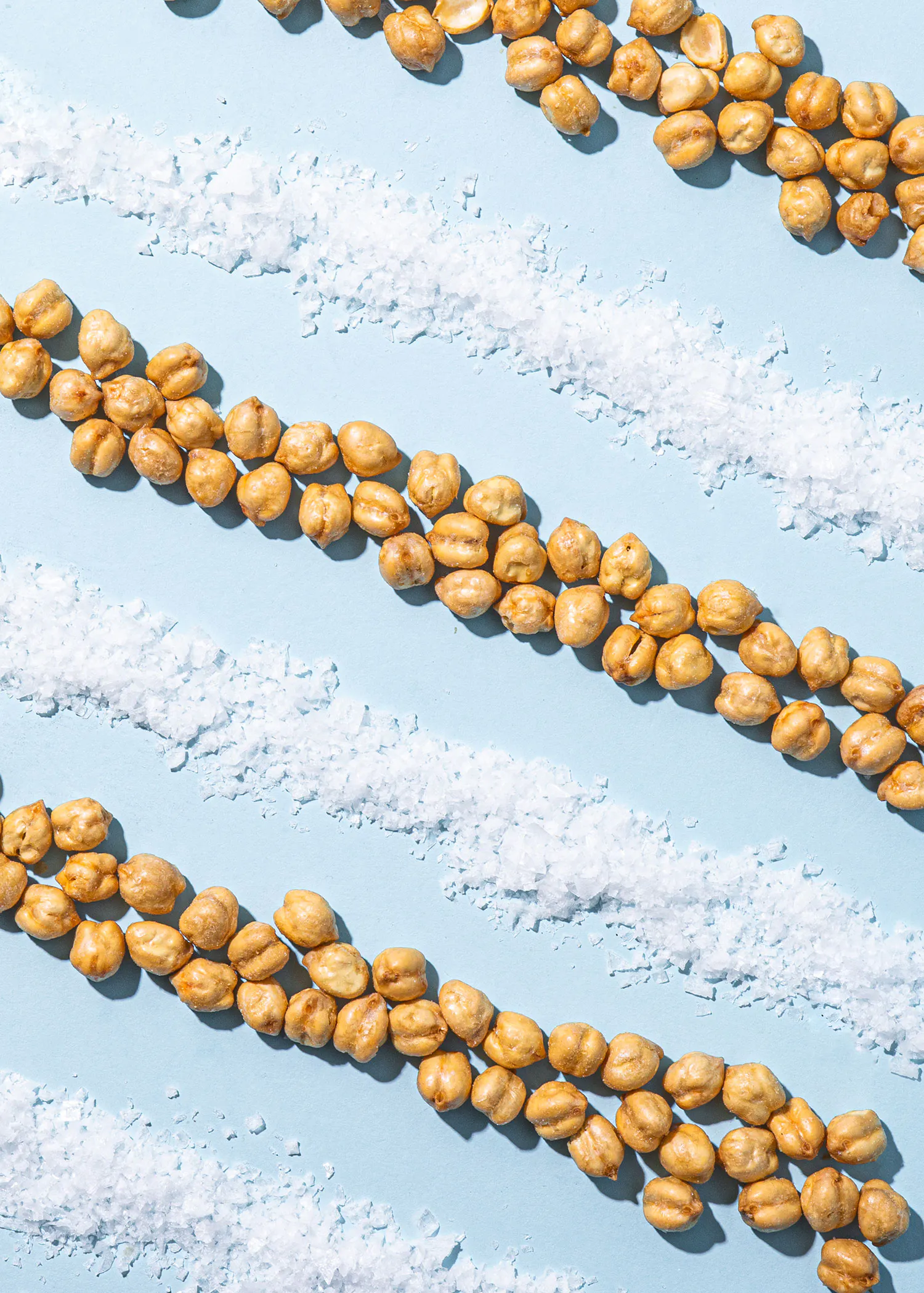 chickpeas and sea salt on a blue surface