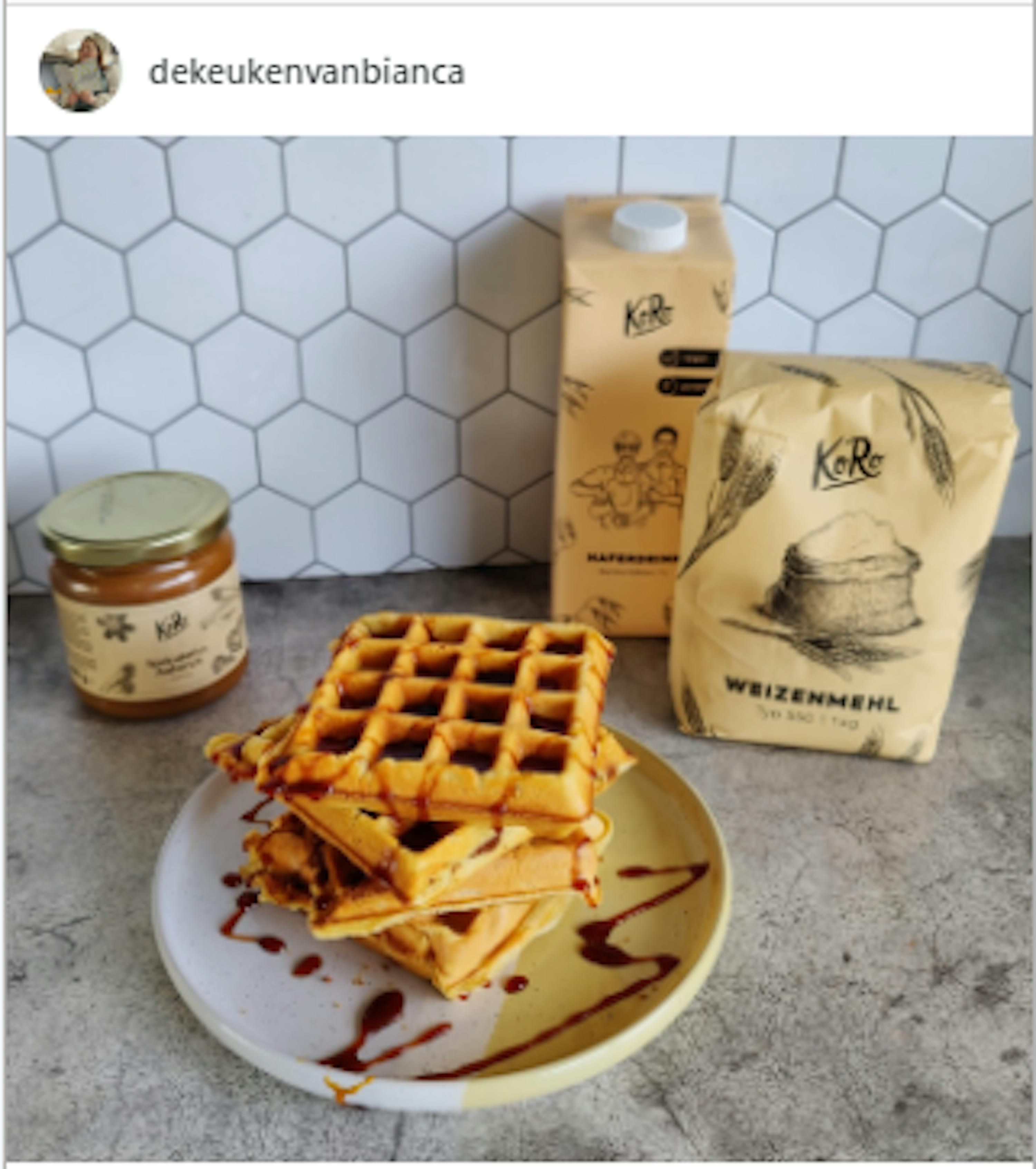 a stack of waffles sits on a plate next to a bag of weizenmehl