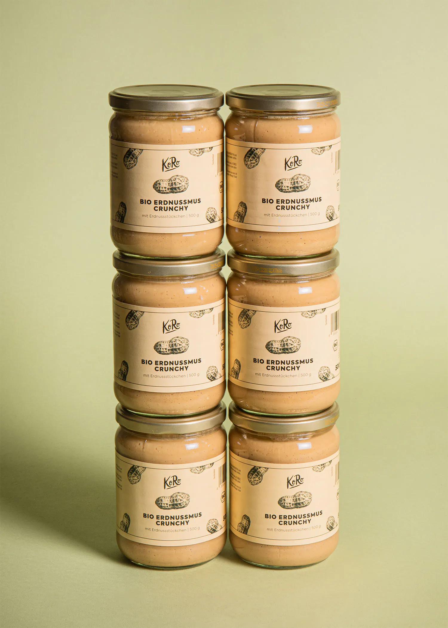 six jars of peanut butter stacked on top of each other