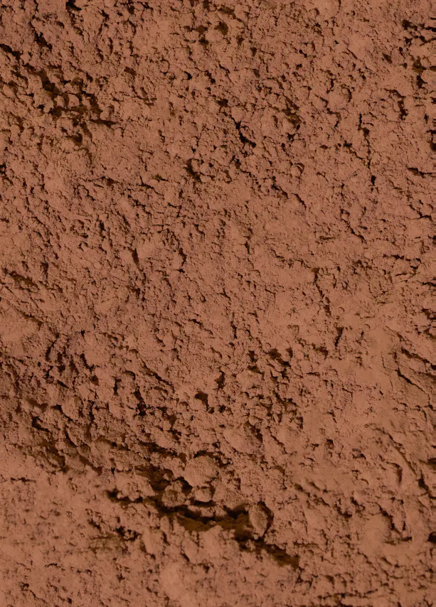 eine nahaufnahme von braunem, körnigem pulver mit unregelmäßiger textur.