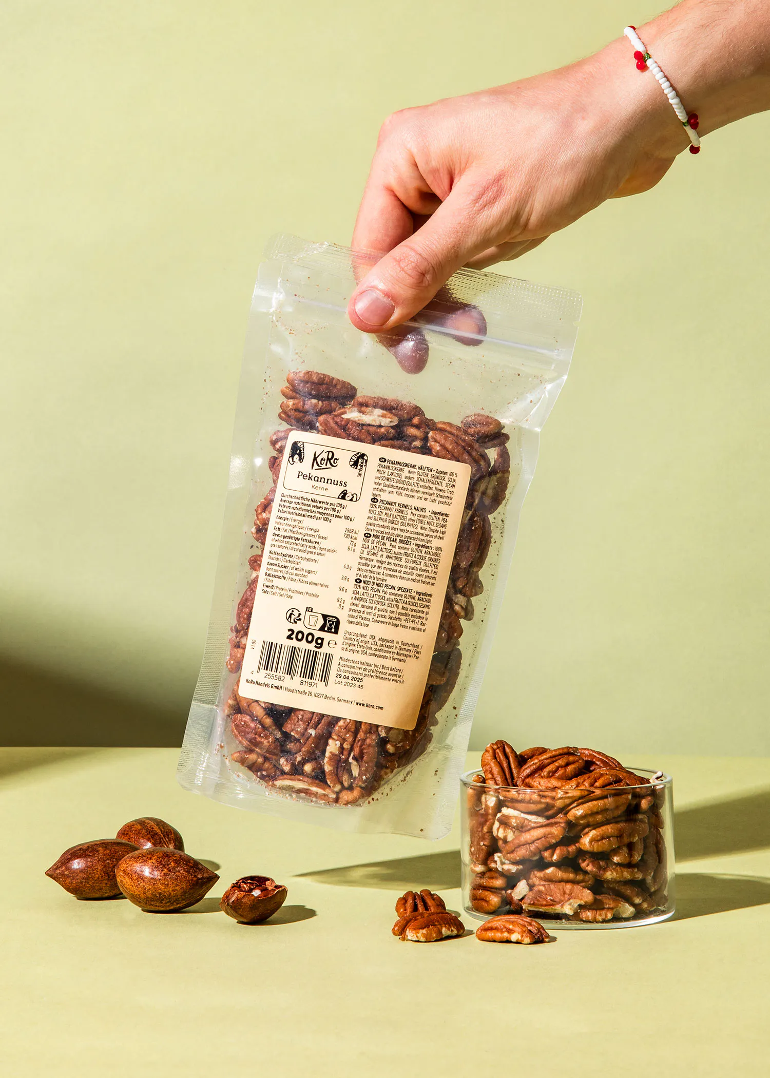 a person is holding a bag of pecans with a label that says " pecans "