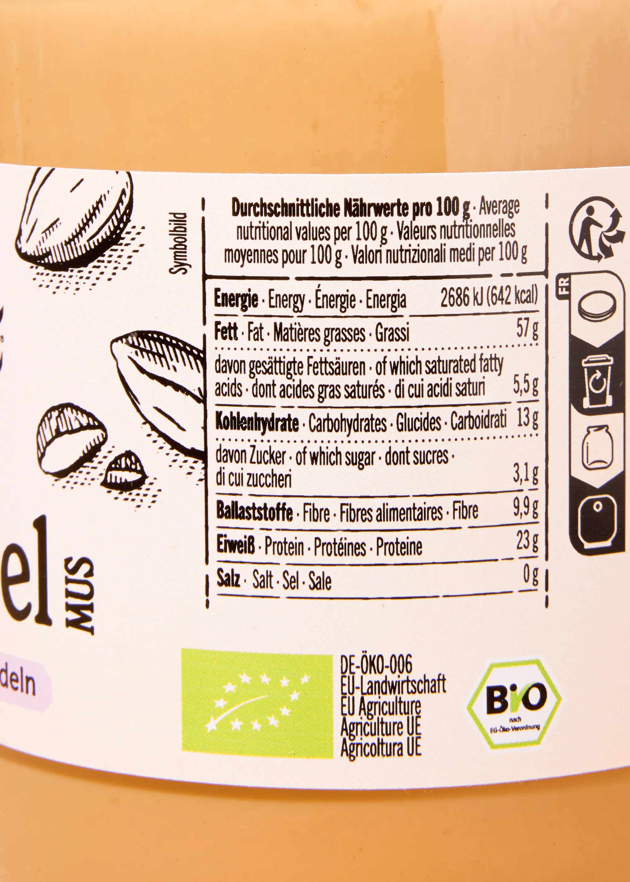 a nutrition facts label on a food product showing energy, fat, carbohydrates, fiber, protein, and salt content per 100 grams, along with an organic certification logo.