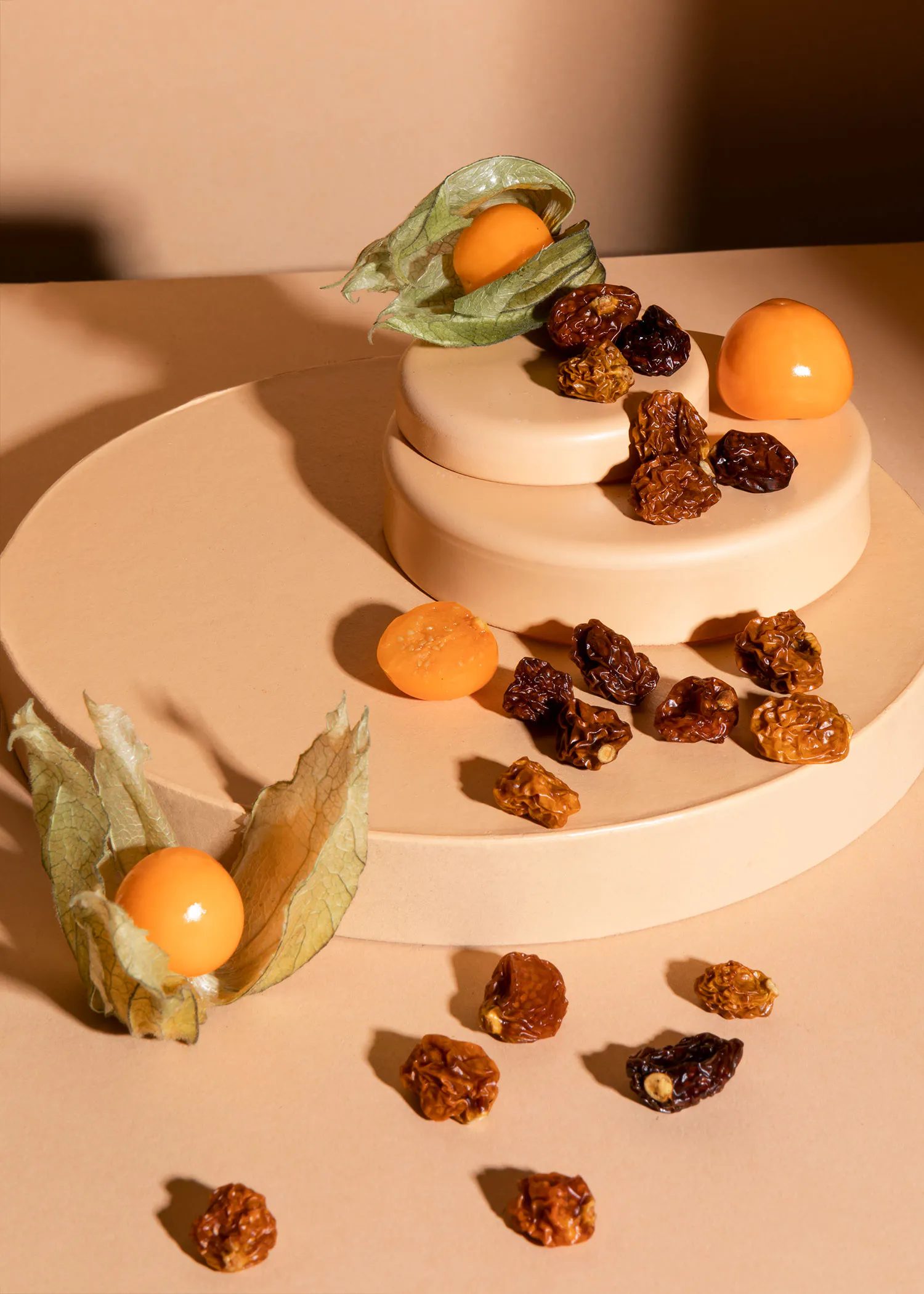 a stack of plates with nuts and fruit on them