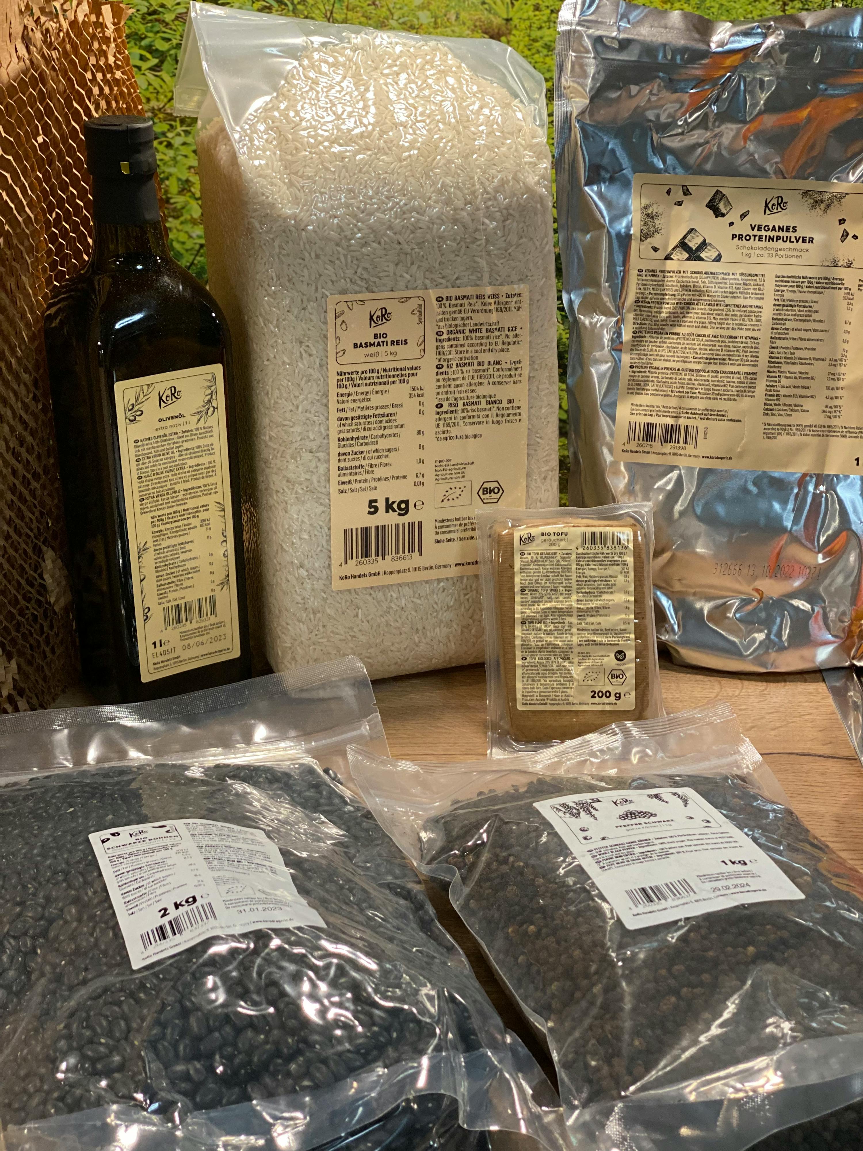 a bag of sesame seeds sits next to a bottle of sesame oil