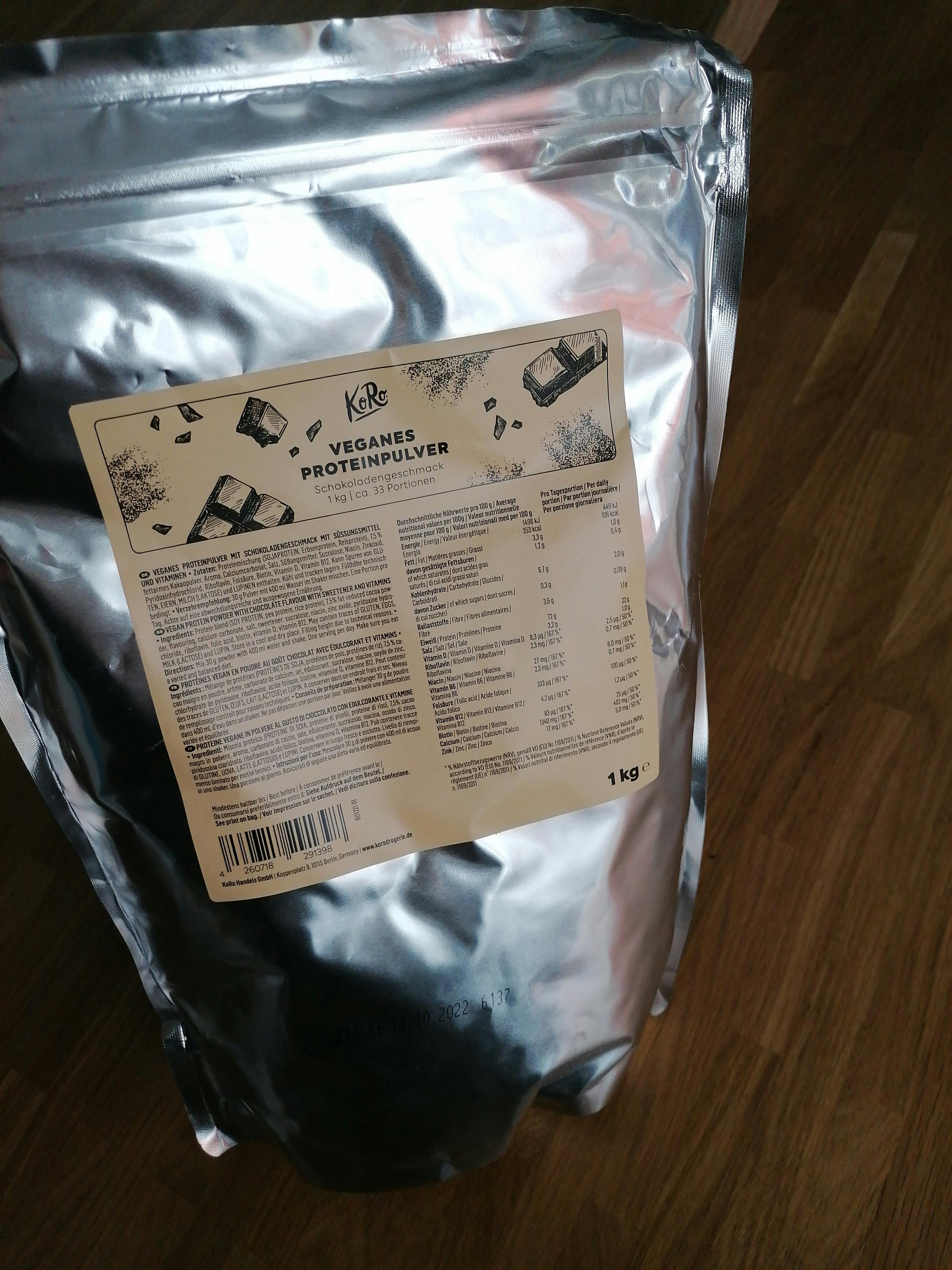 a bag of keri veganes proteinpulver is on a wooden table