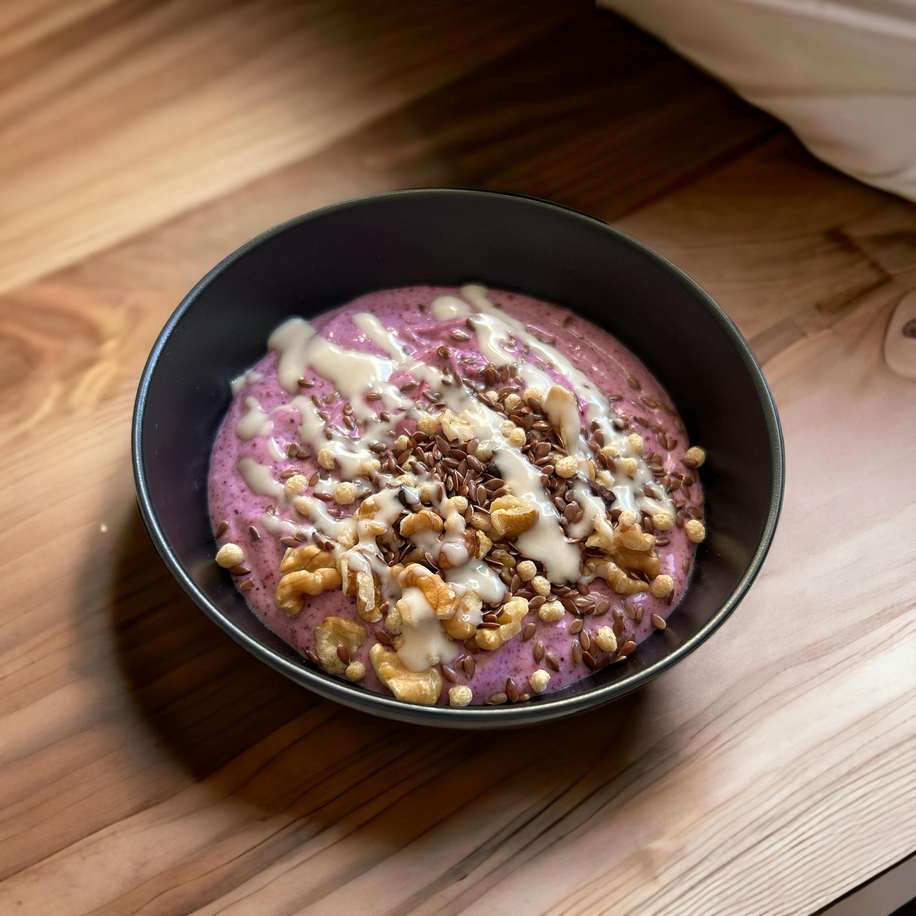 a bowl of food with nuts and chocolate sprinkles on top