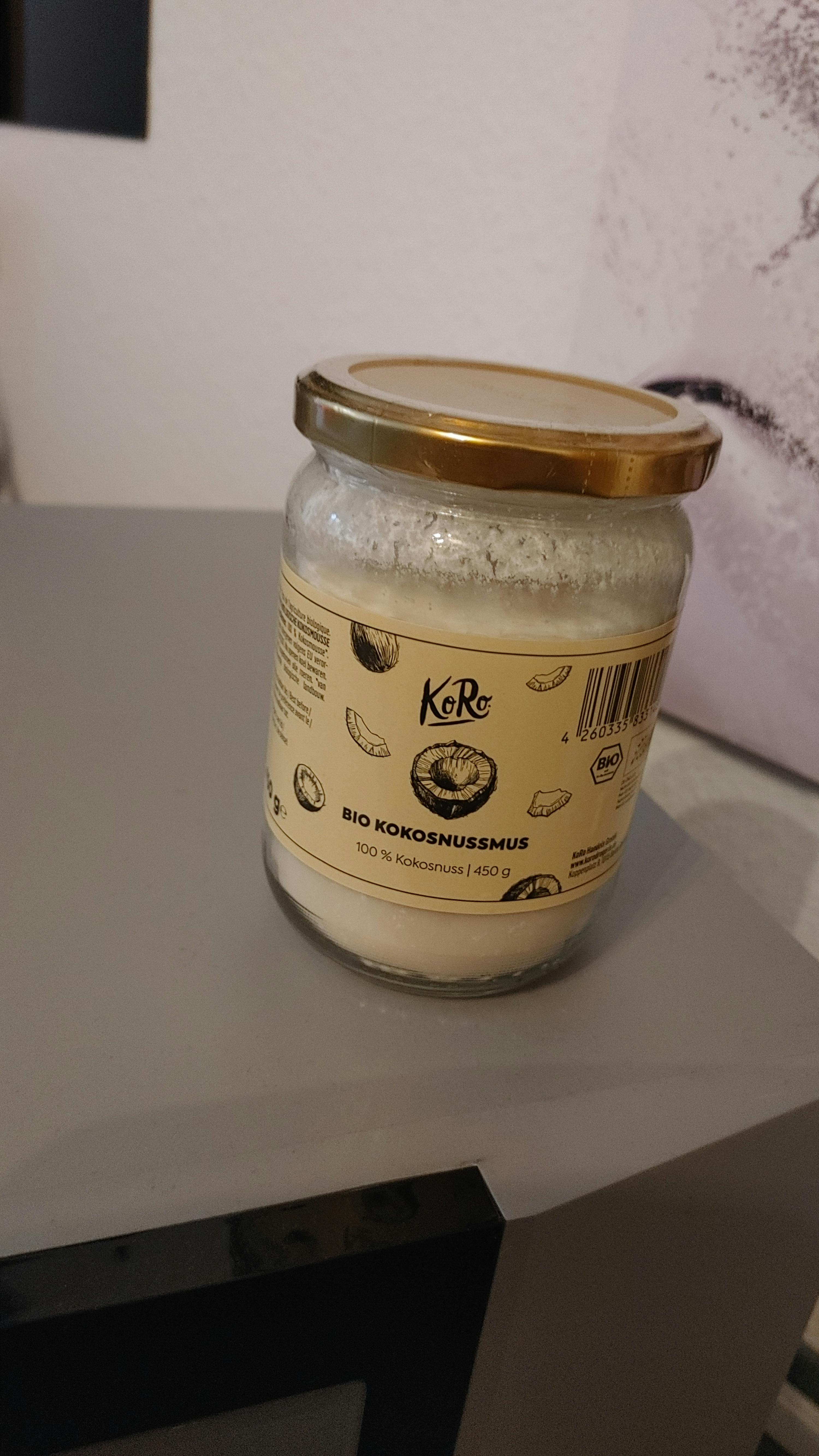 a jar of bio kokosnussmus is sitting on a table