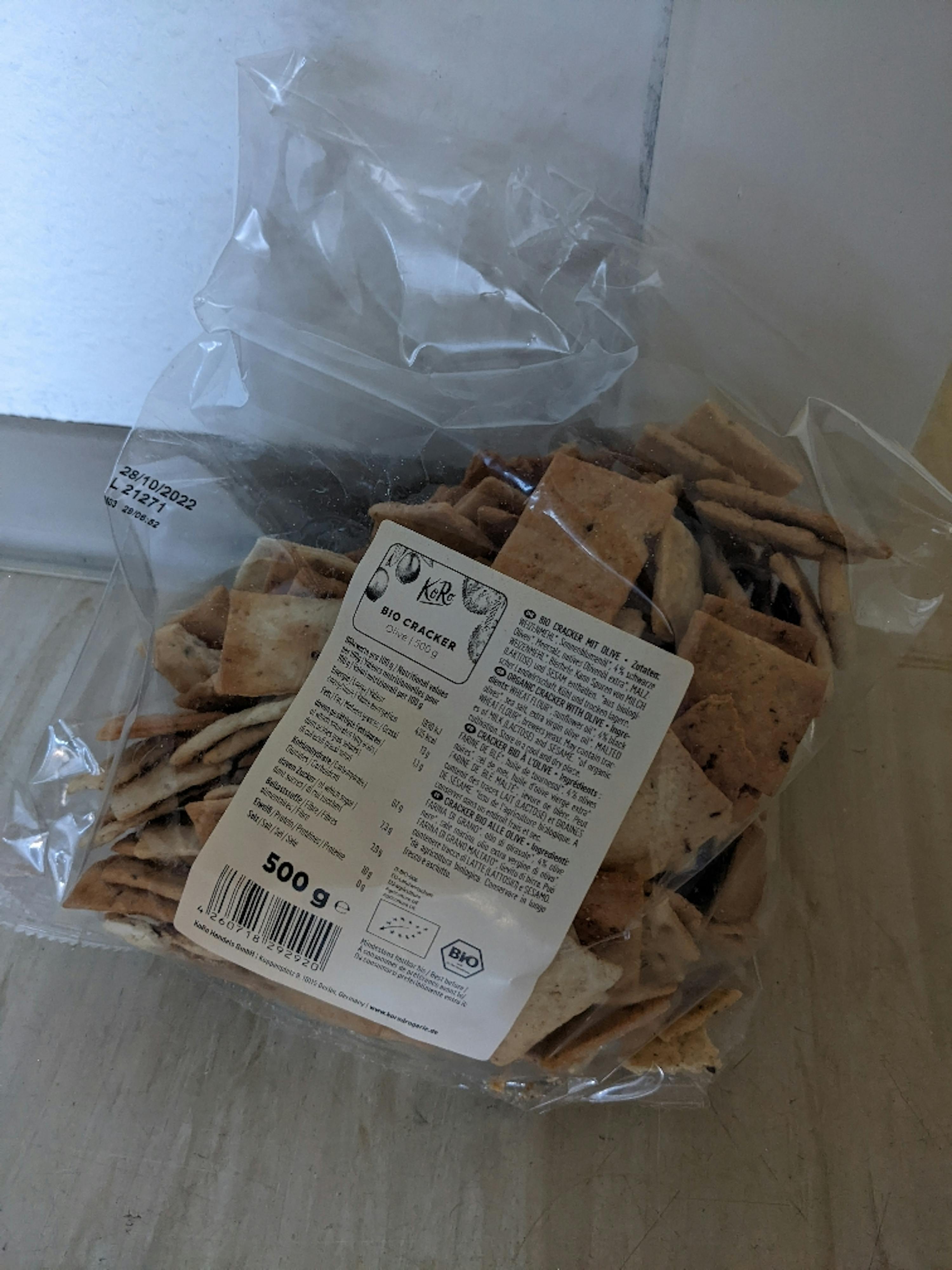 a bag of bio crackers sits on a wooden table