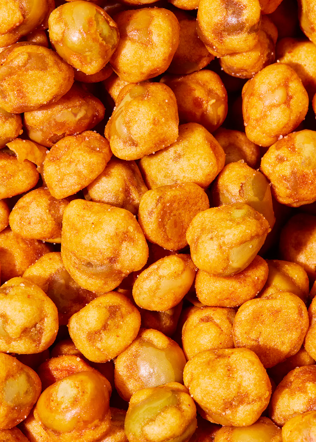 a close up of a pile of fried beans