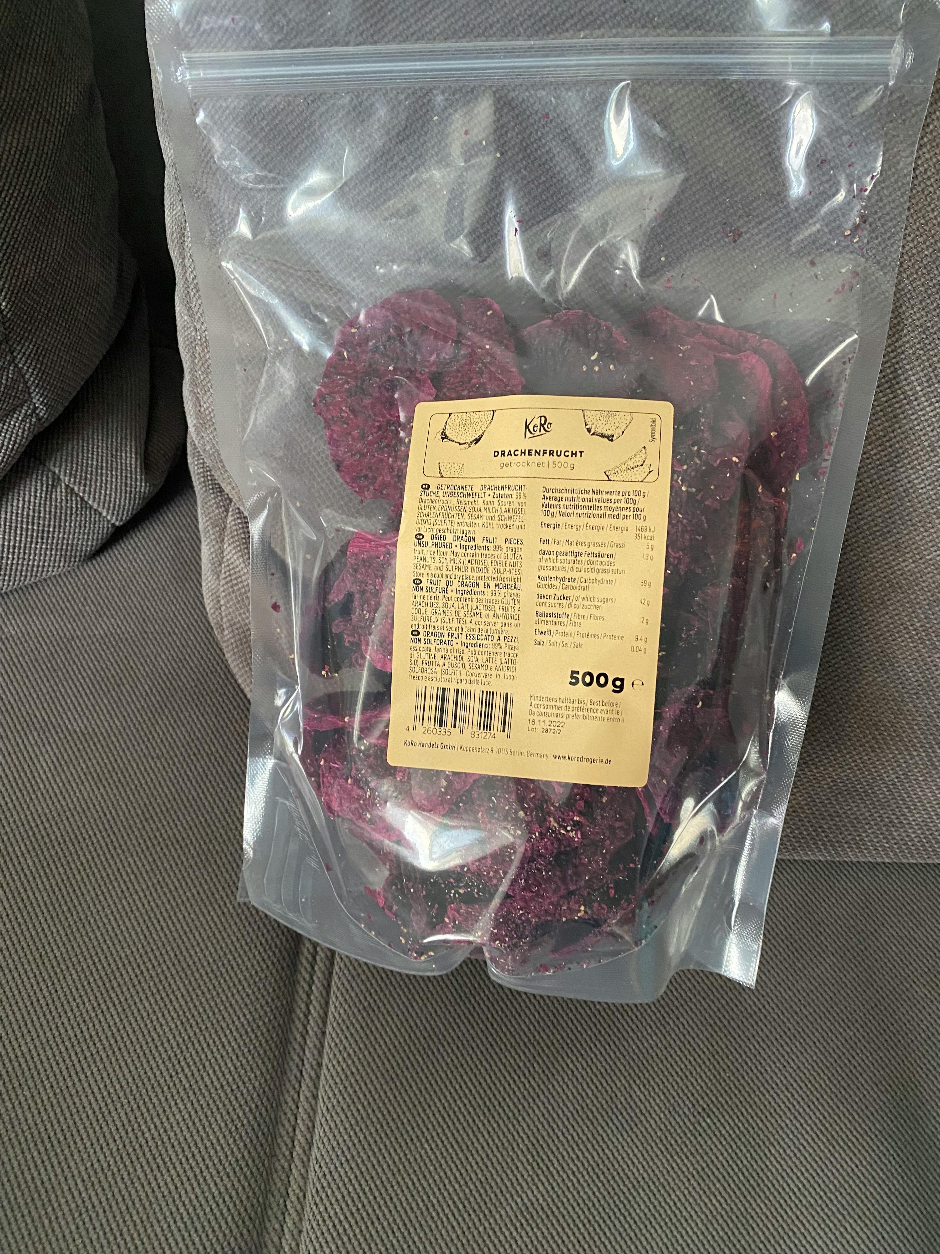 a bag of dried dragon fruit is sitting on a couch