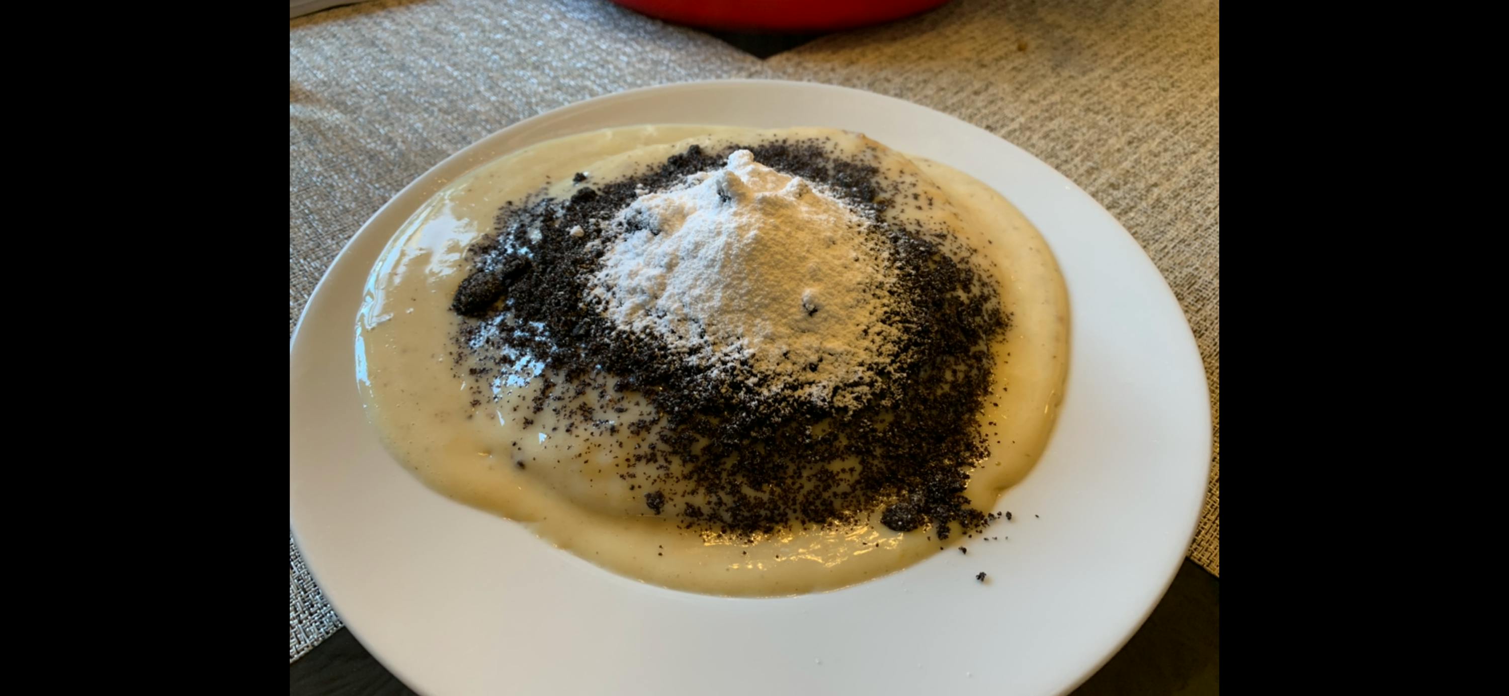 a plate of food with powdered sugar on top of it