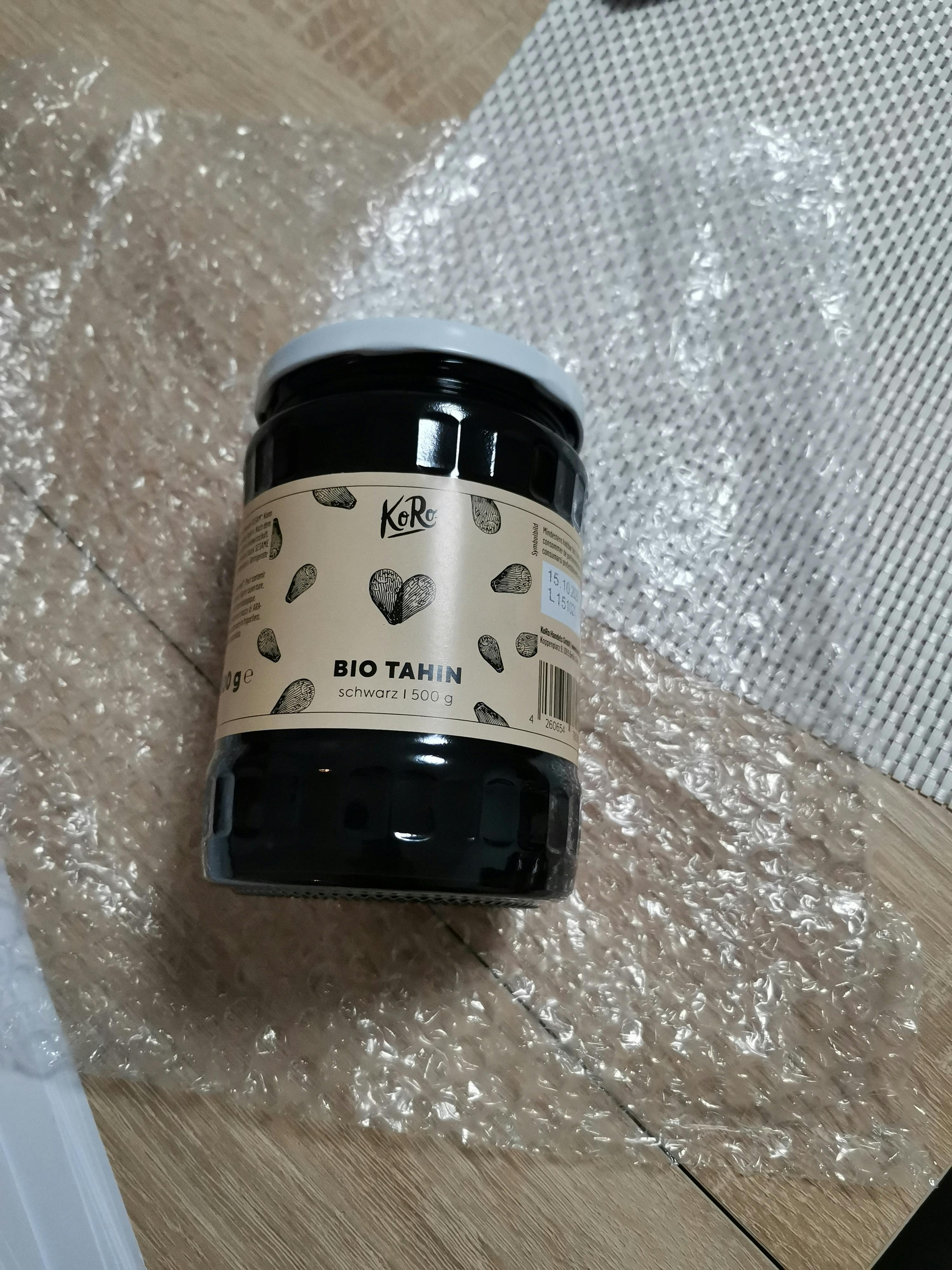 a jar of bio tahin is sitting on a table