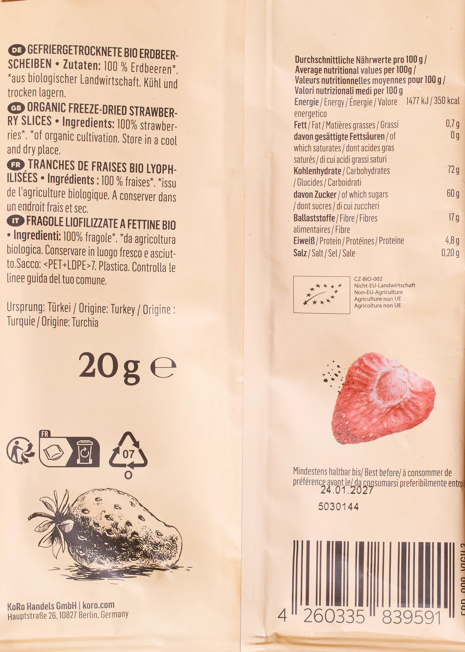 a light-colored package of organic freeze-dried strawberry slices, displaying nutritional information, a 20g weight, a best before date of 24.01.2027, and illustrations of strawberries.