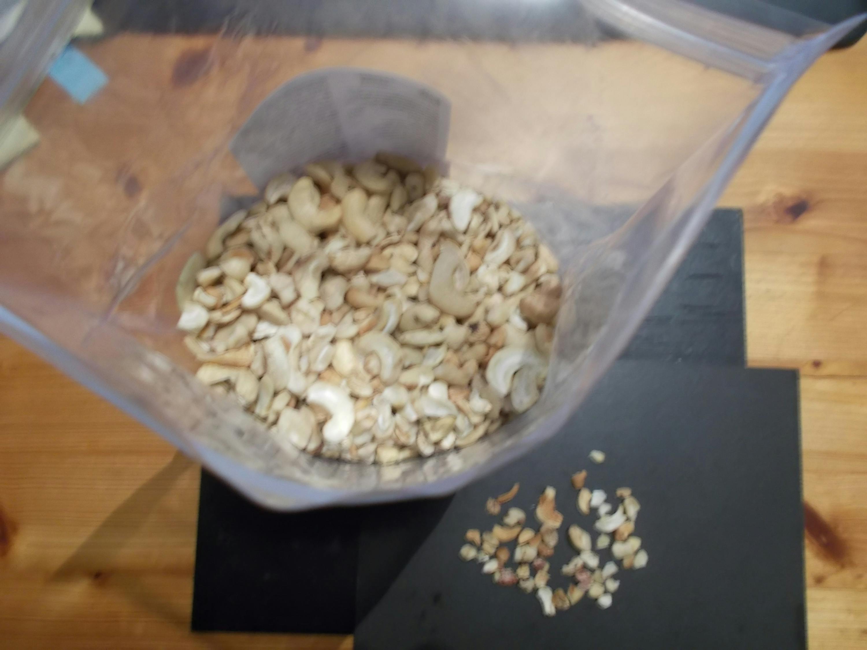 a plastic bag filled with nuts is on a table