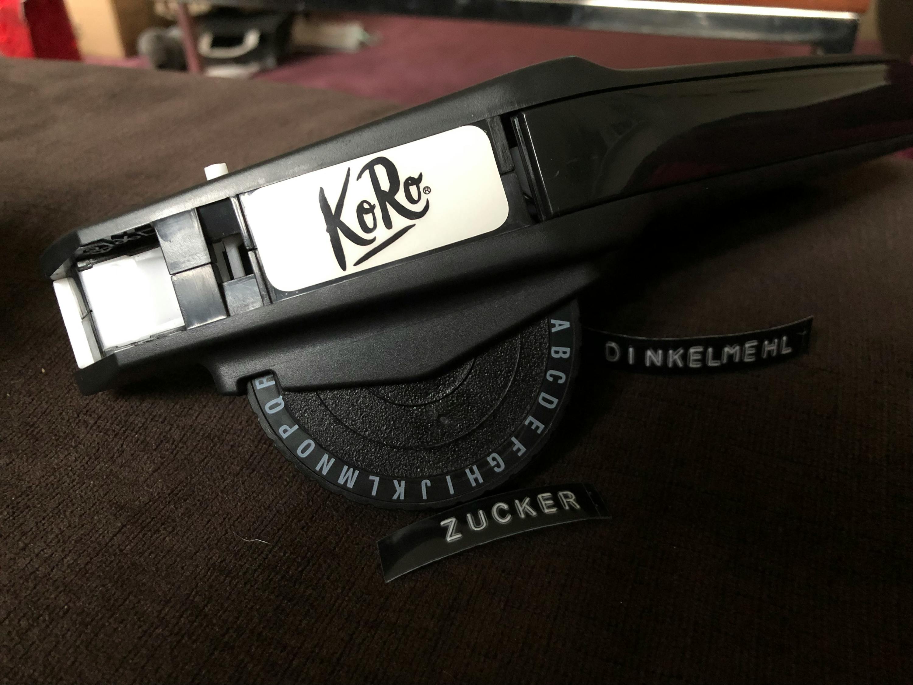 a label maker with the word kore on it