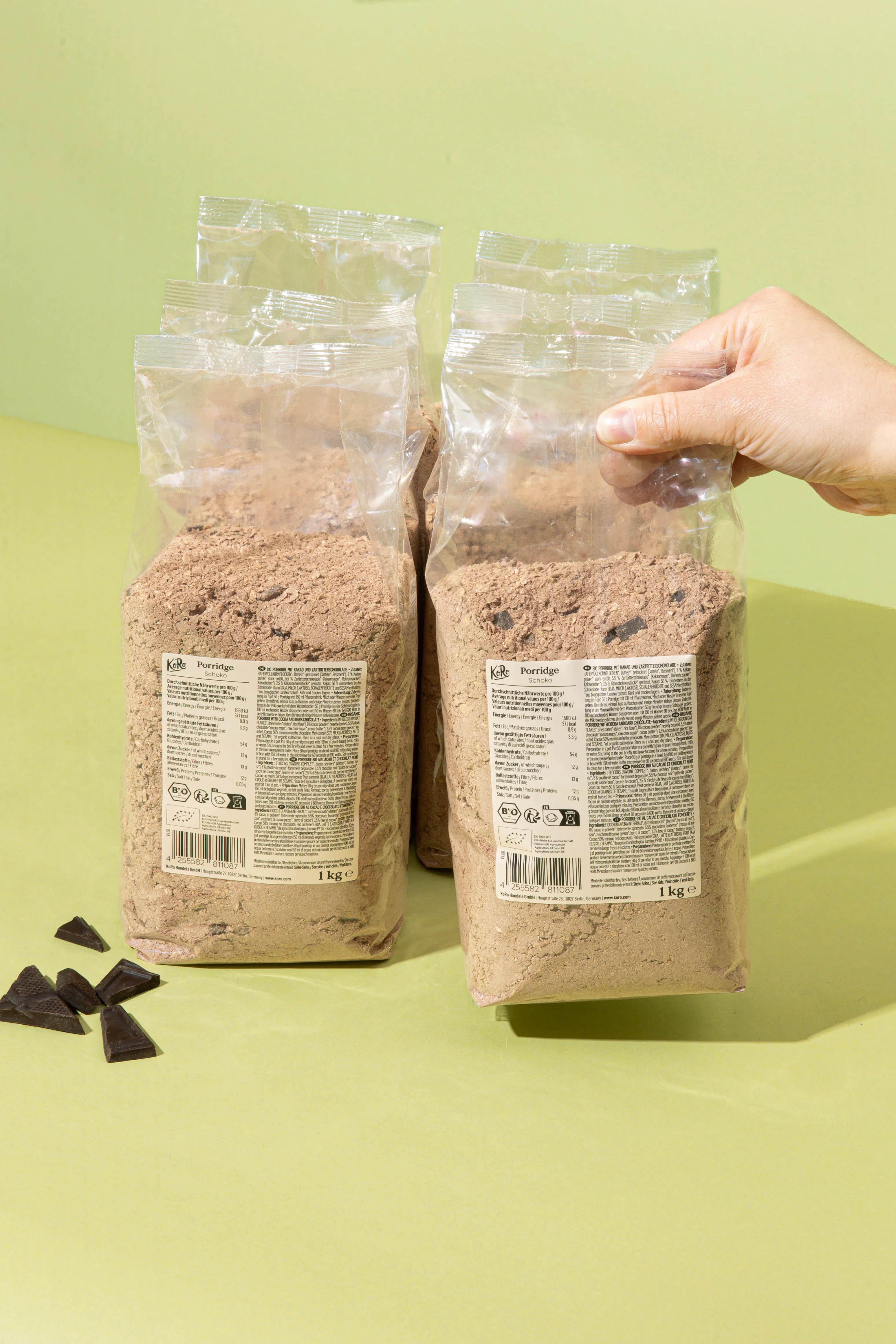 a person is holding a bag of cocoa powder