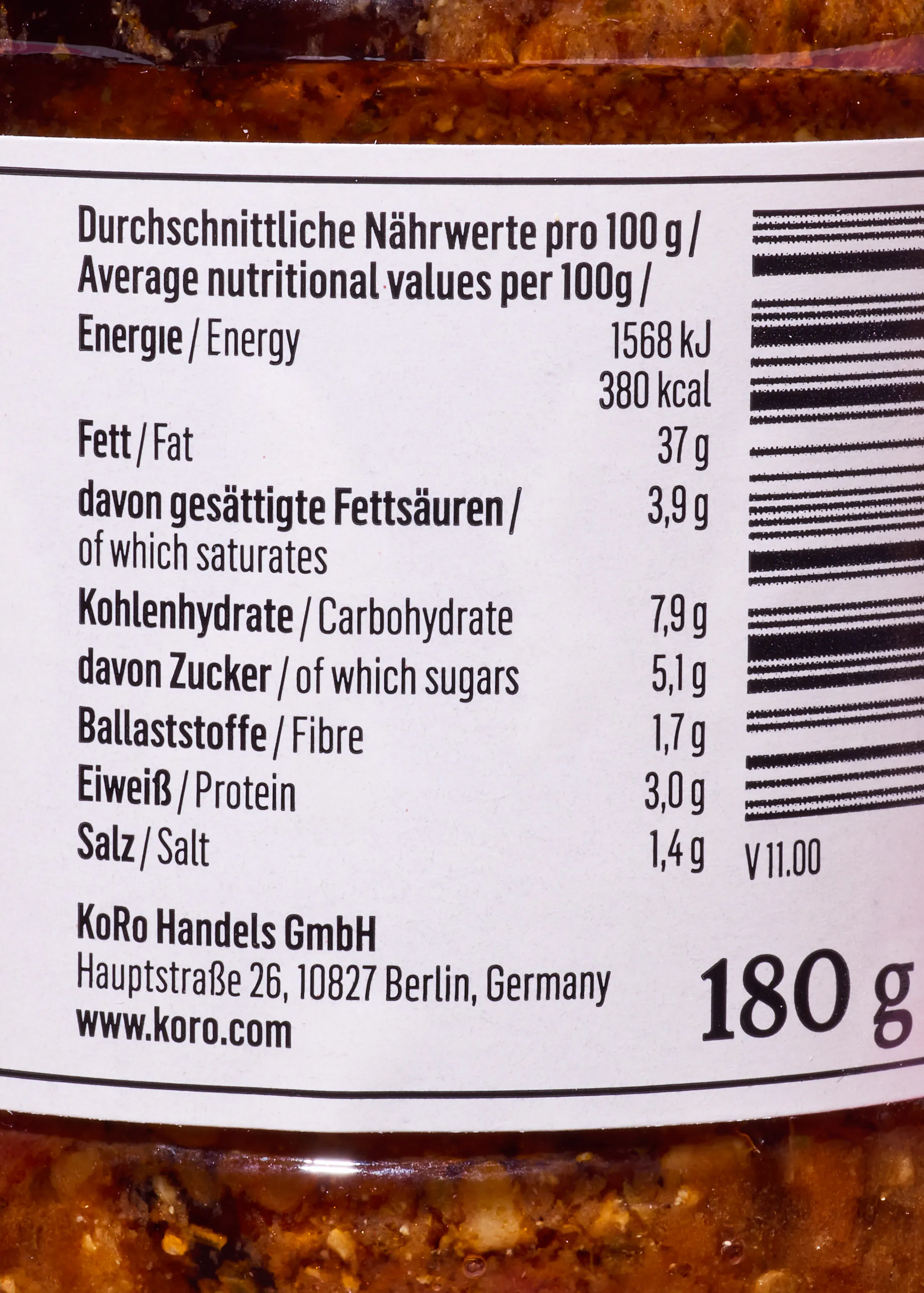 a food label displaying average nutritional values per 100g, including energy, fat, carbohydrates, protein, and salt, along with company contact information and a 180g product weight.