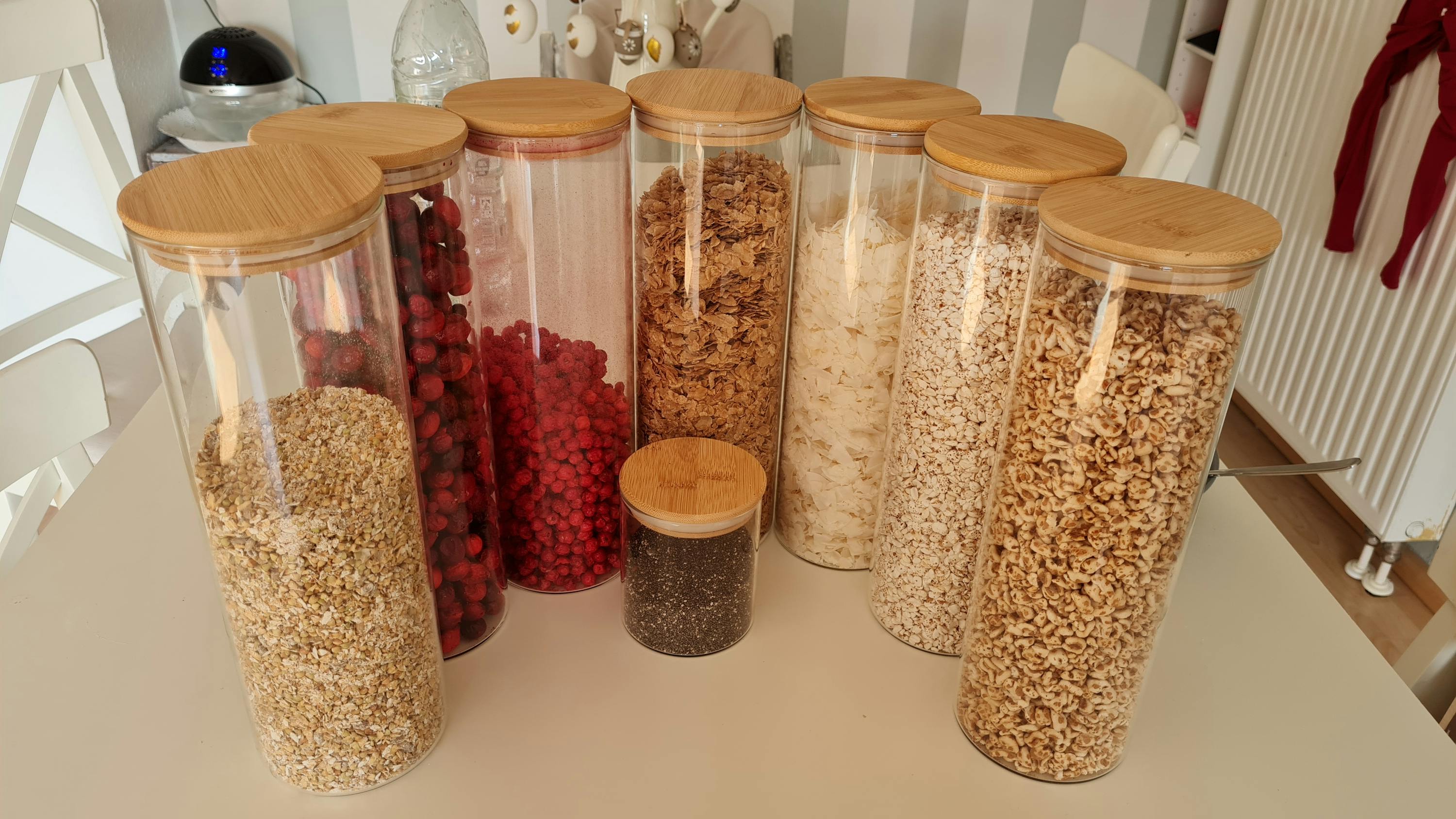 several glass jars filled with different types of grains