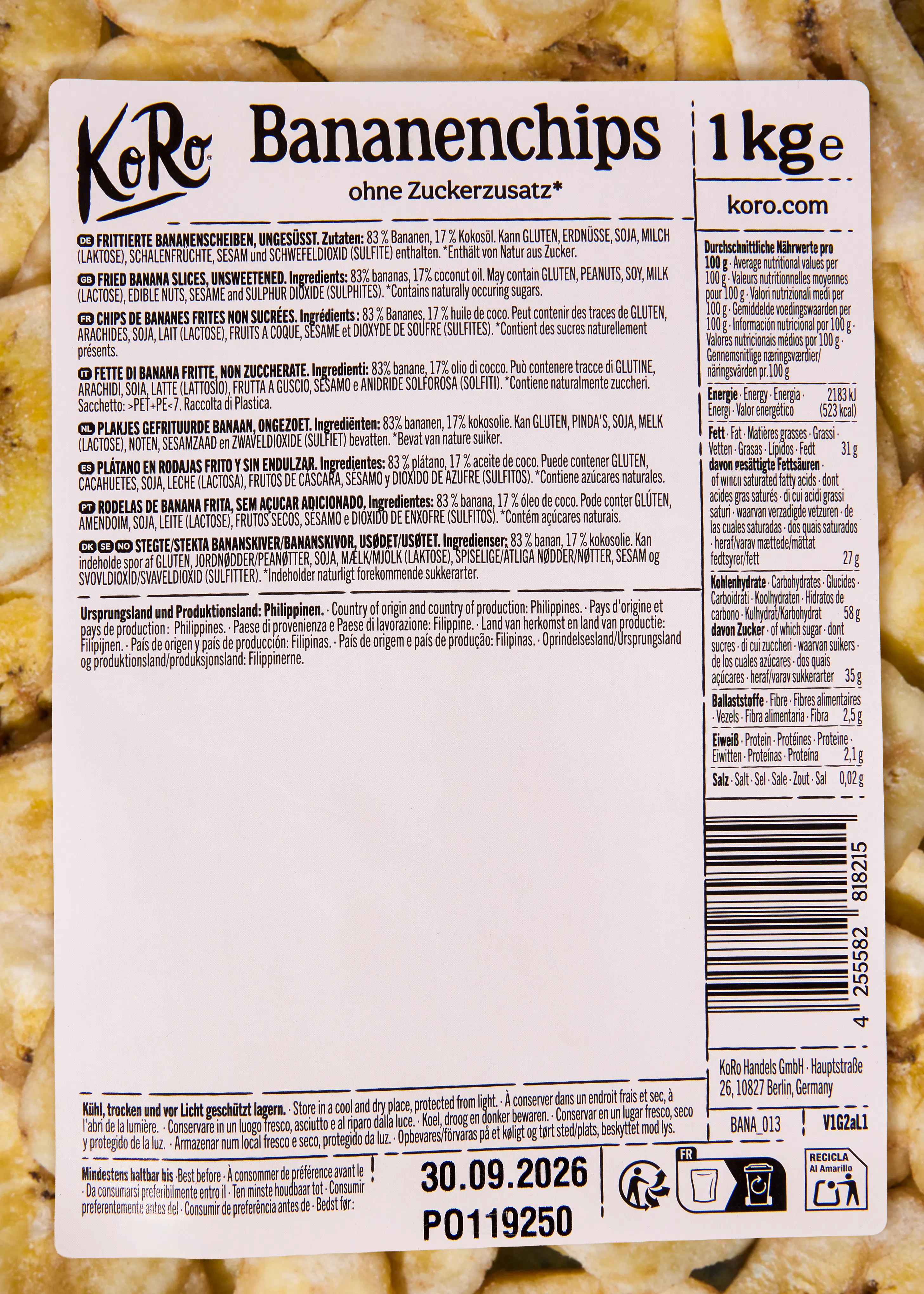 ein weißes produktetikett für koro bananenchips ohne zuckerzusatz mit zutaten, nährwertangaben und haltbarkeitsdatum.