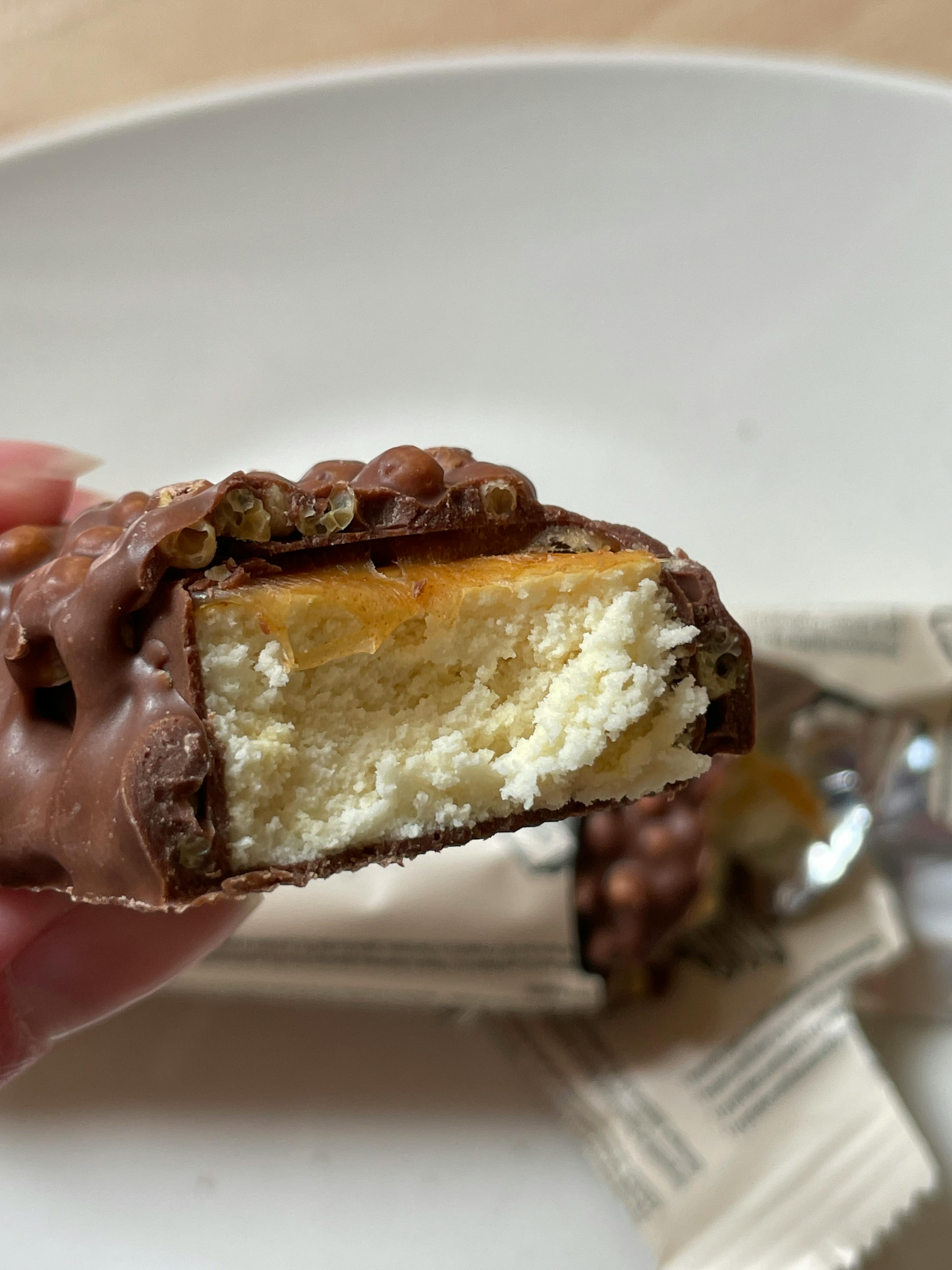 a close up of a chocolate bar with a bite taken out of it