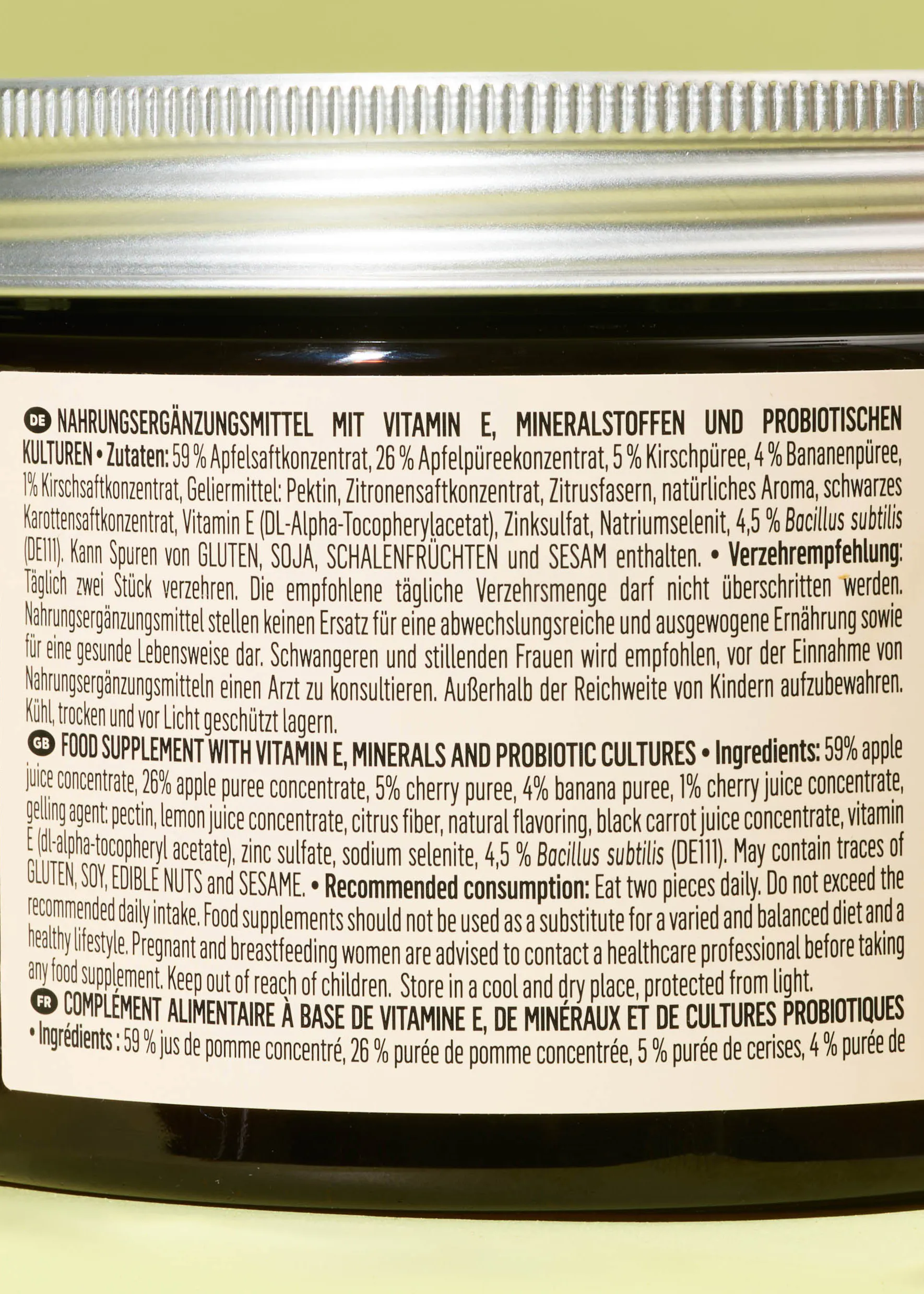 a jar of food supplement with vitamin e minerals and probiotic cultures