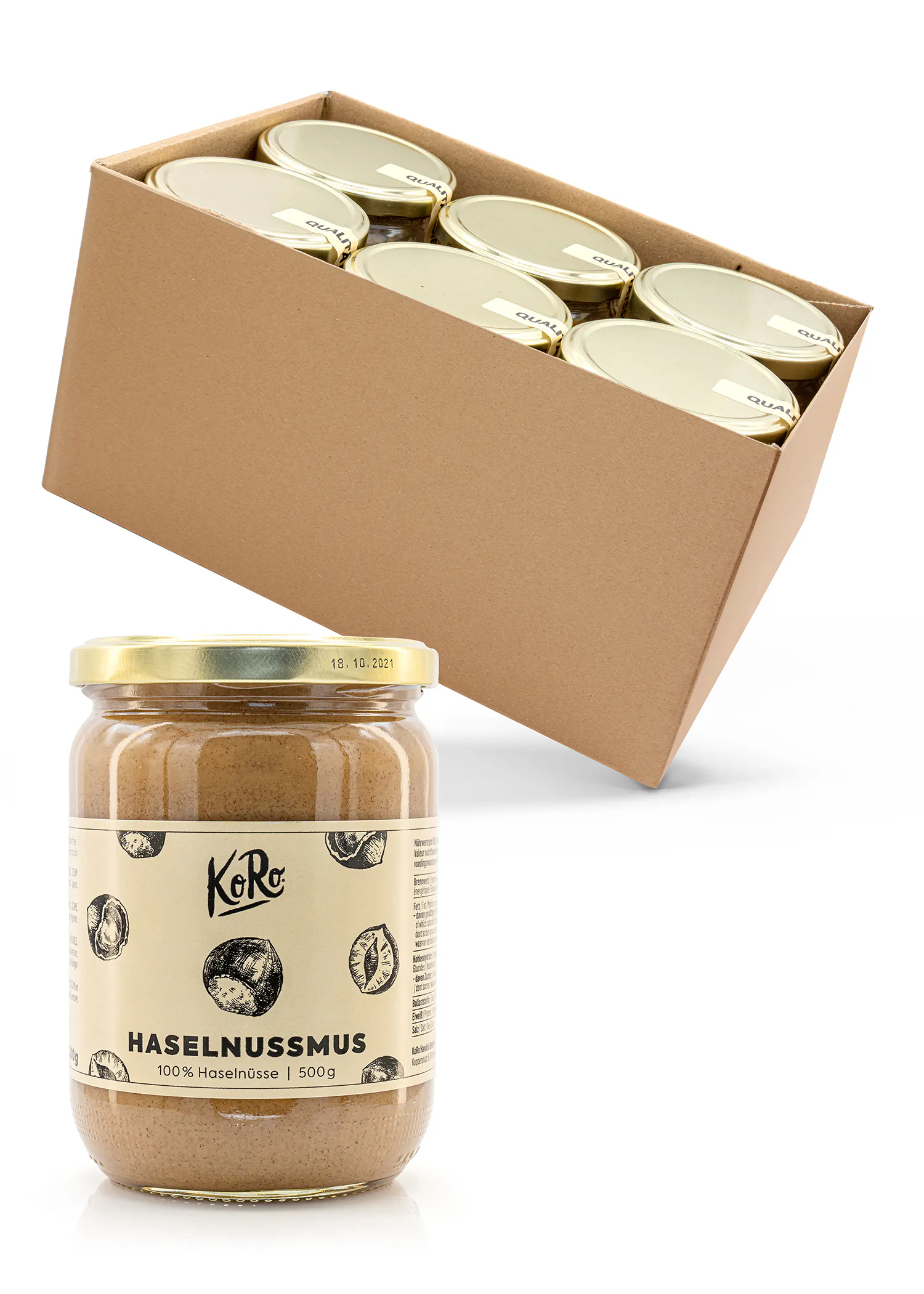 ein Glas haselnussmus steht neben einer Schachtel mit haselnussmus