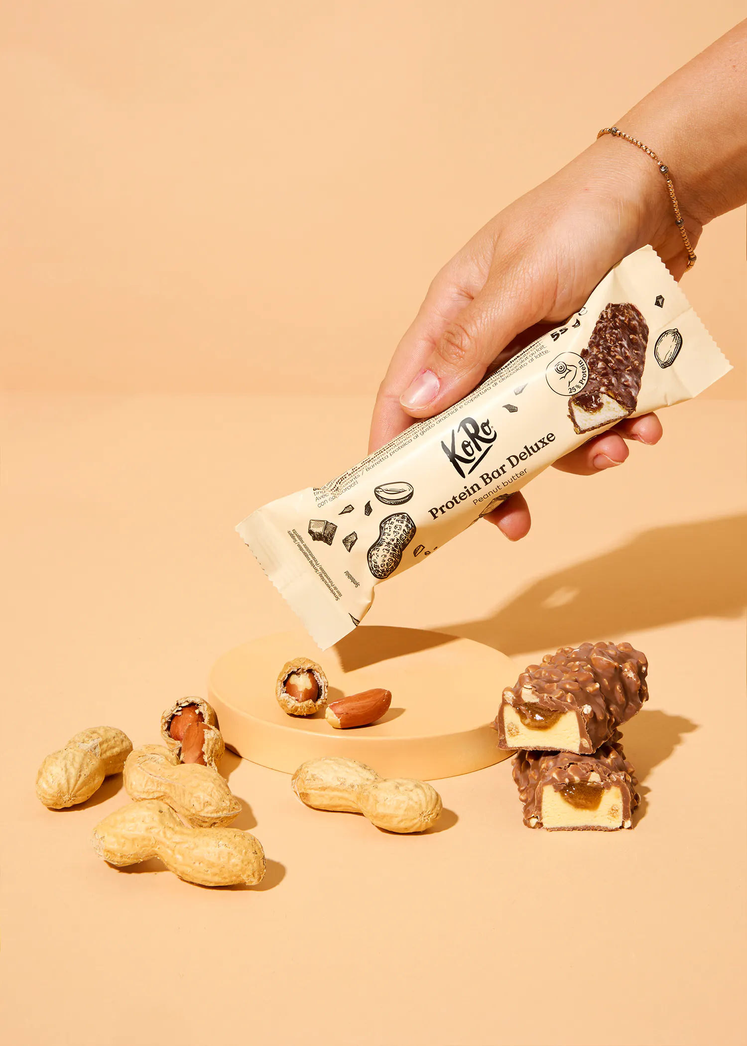 a person is holding a peanut butter protein bar