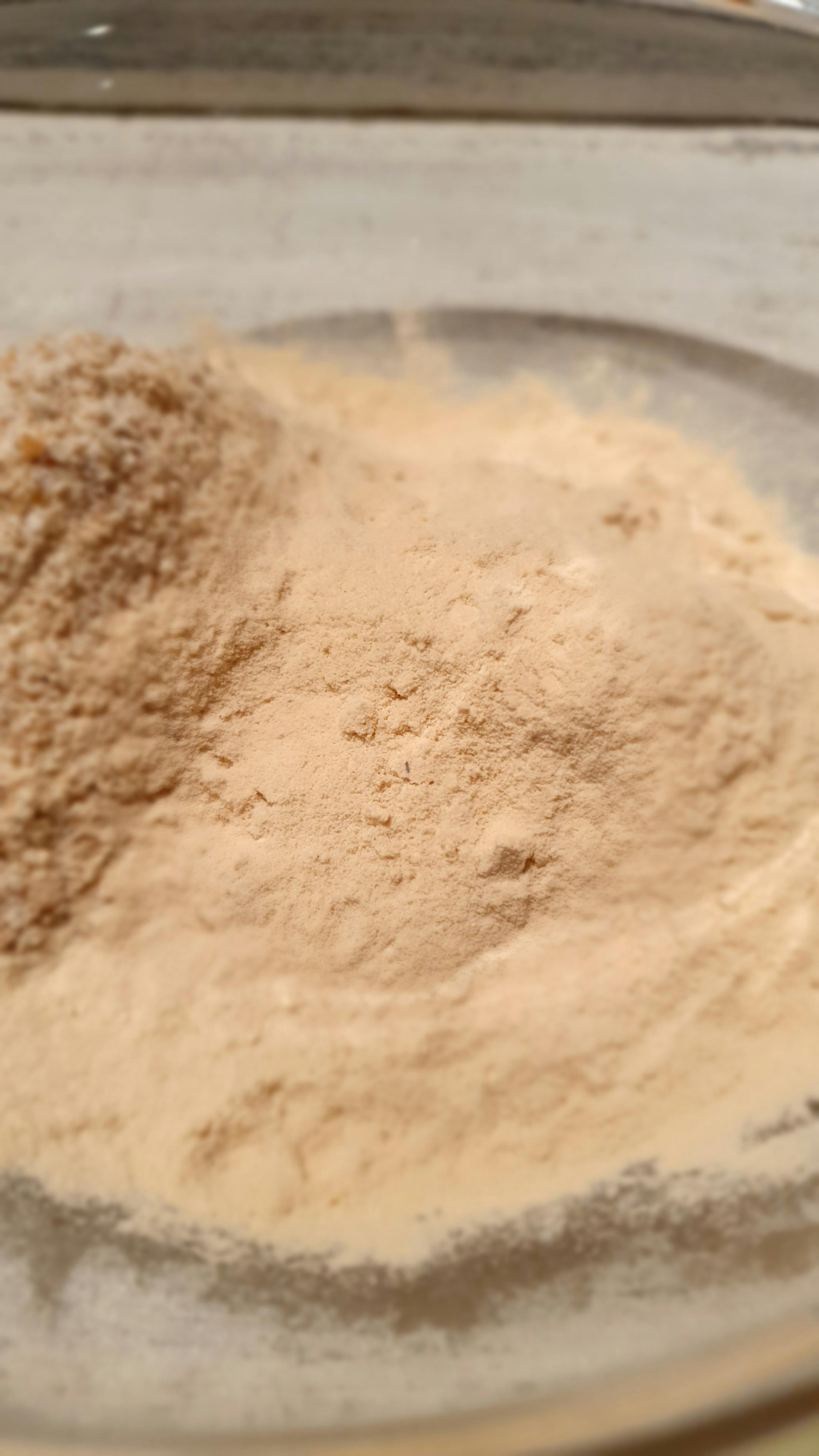 a close up of a pile of brown powder