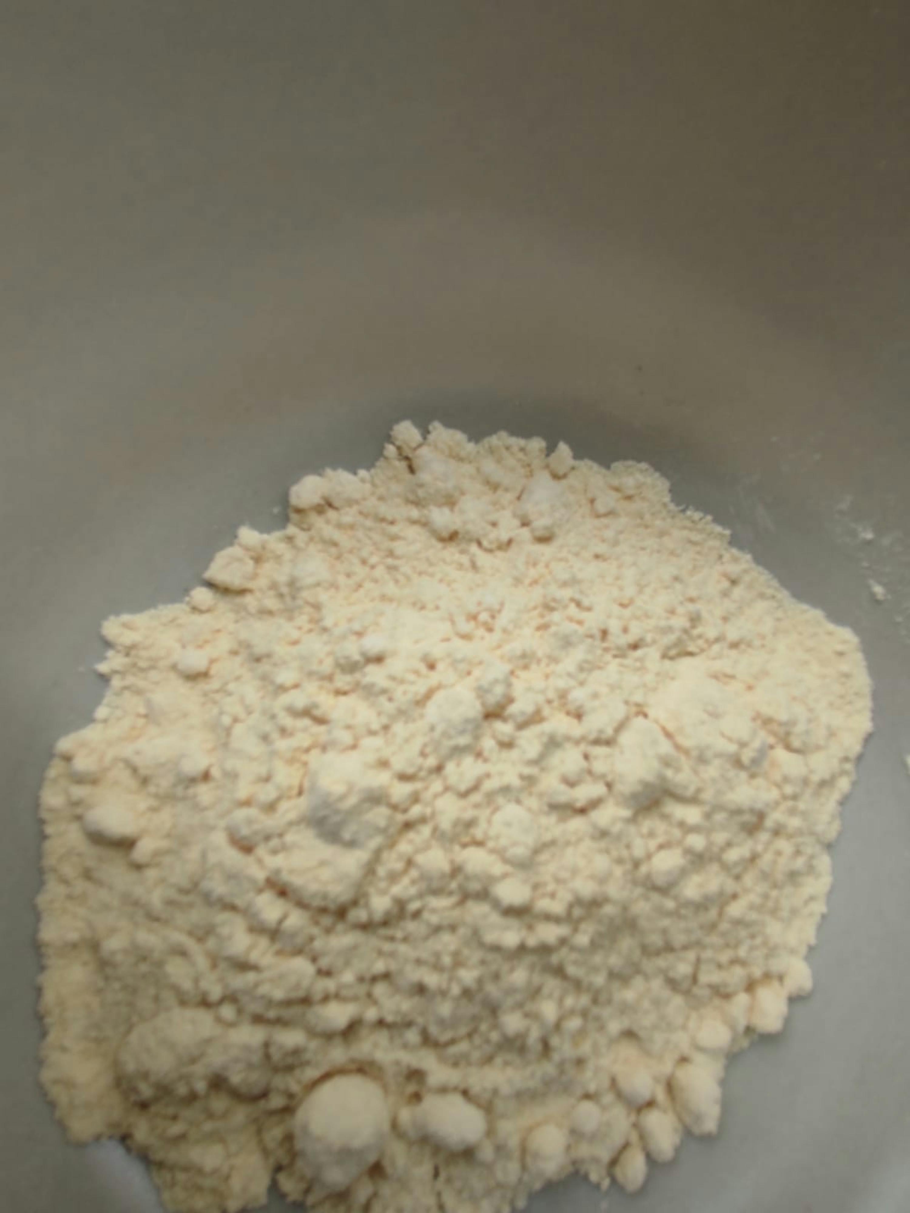 a pile of white powder is in a white bowl
