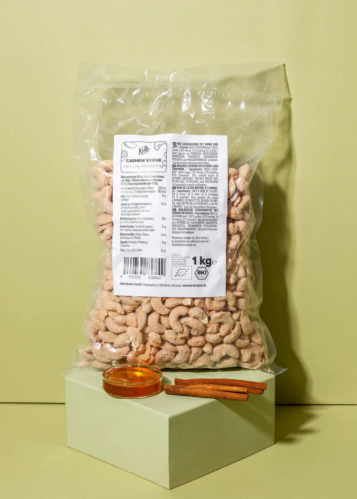 a bag of cashews sits on a green cube