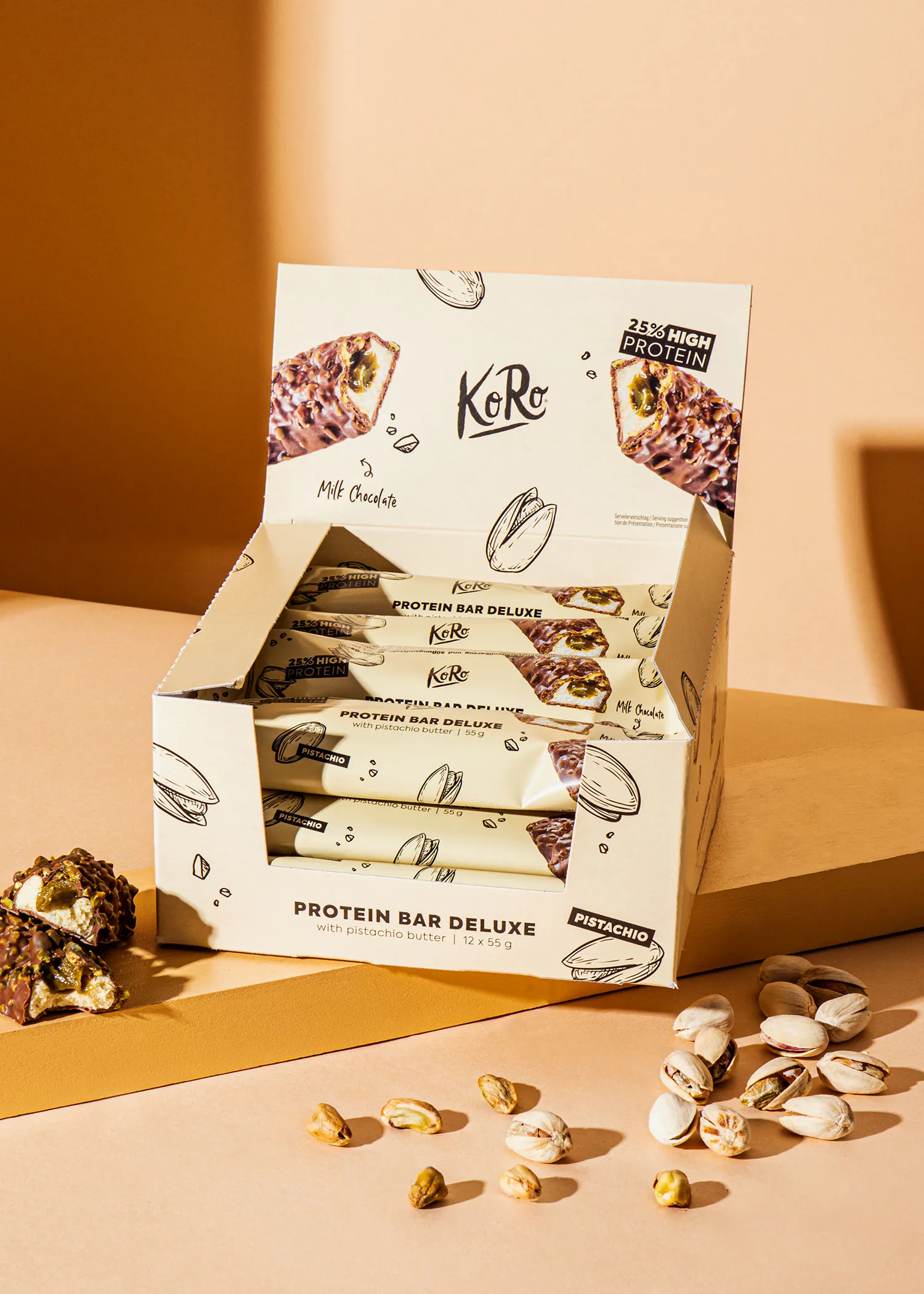 a box of koko protein bar deluxe sits on a table
