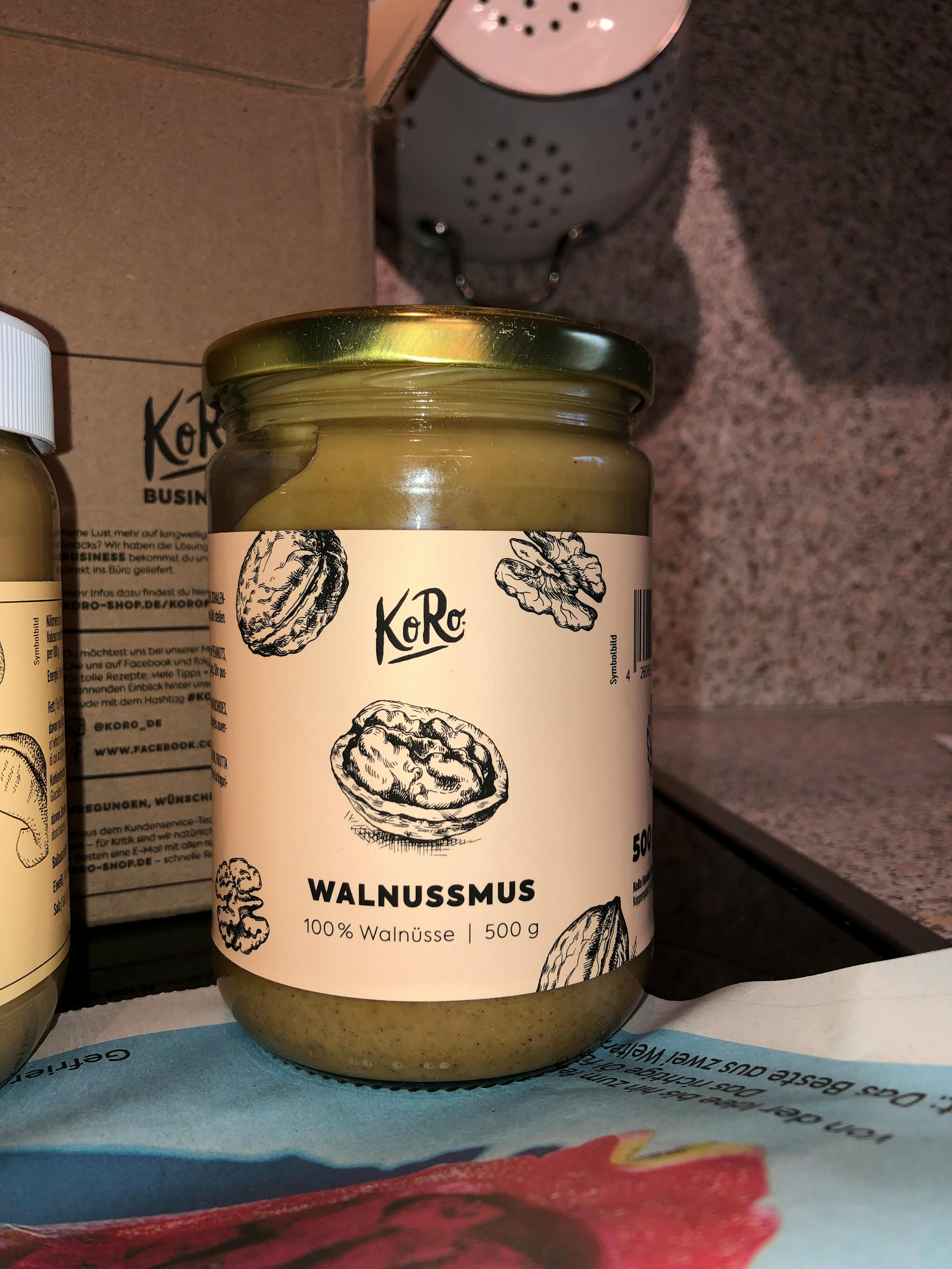 a jar of walnutmus is sitting on a table