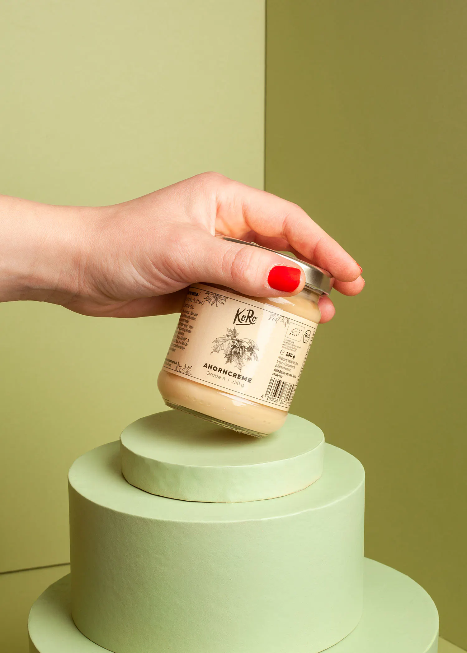 a person is holding a jar that says korc on it