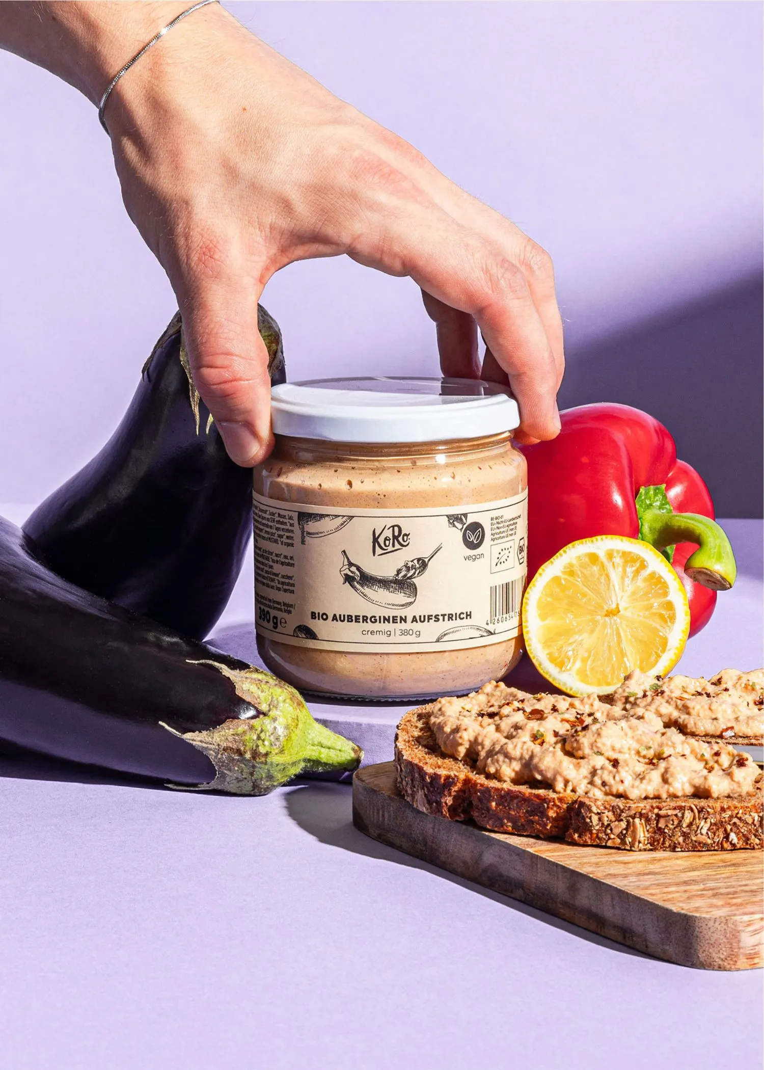 a person is reaching for a jar of sauce that says " kere " on it