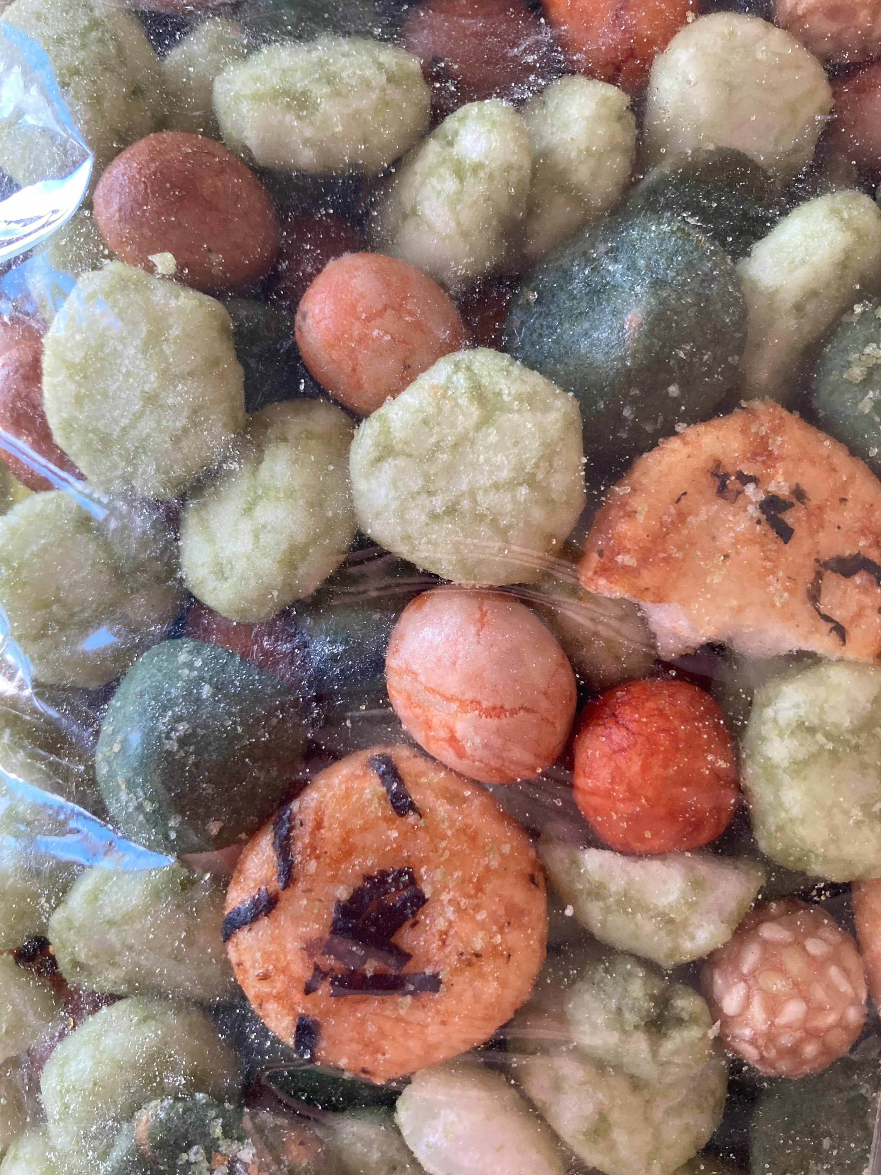 a close up of a bag of mixed nuts with a smiley face on it
