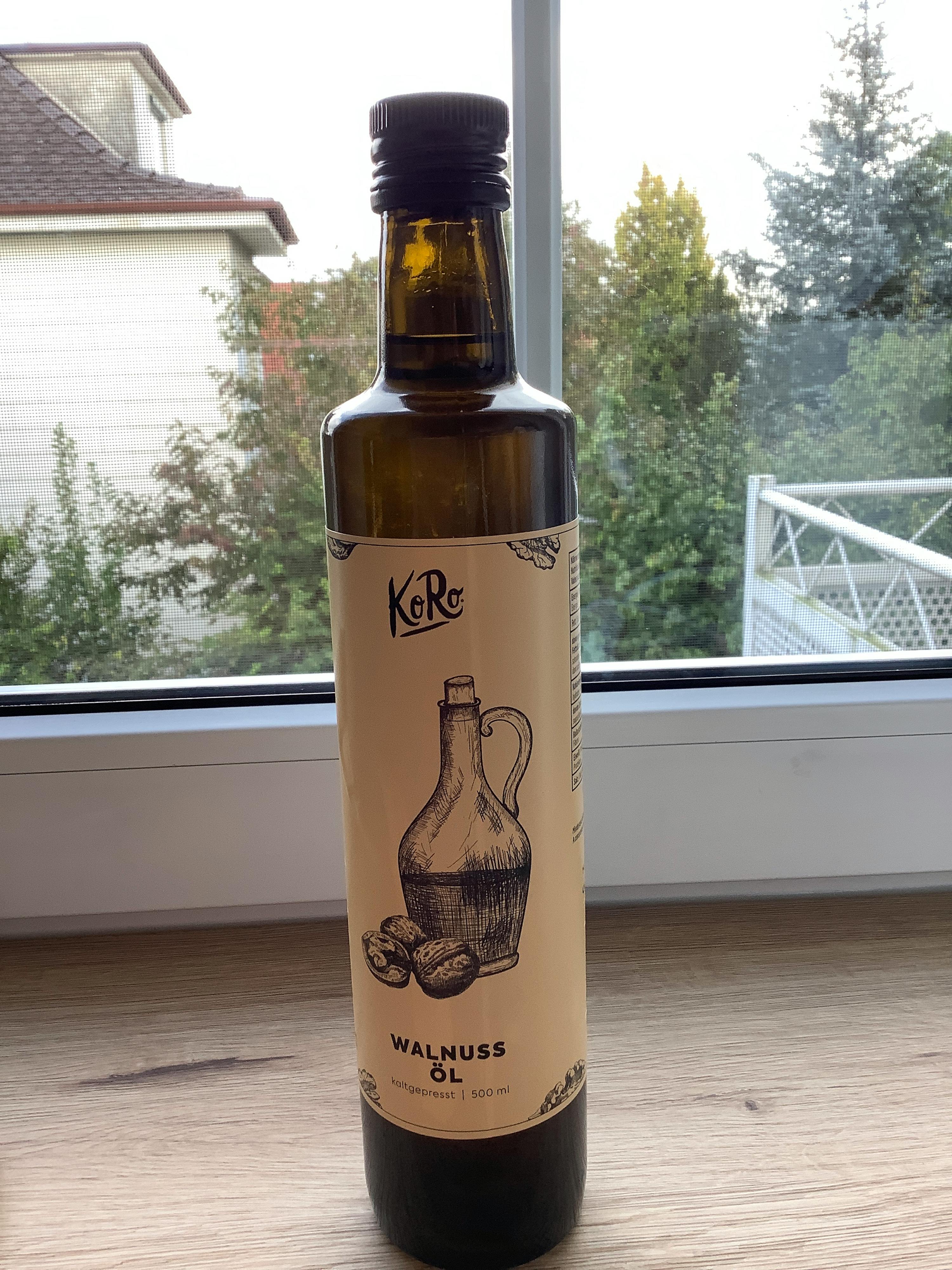 a bottle of walnut oil sits on a table