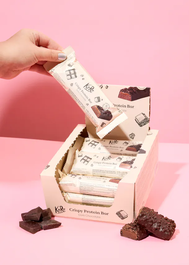 a box of k & r crispy protein bars dark chocolate