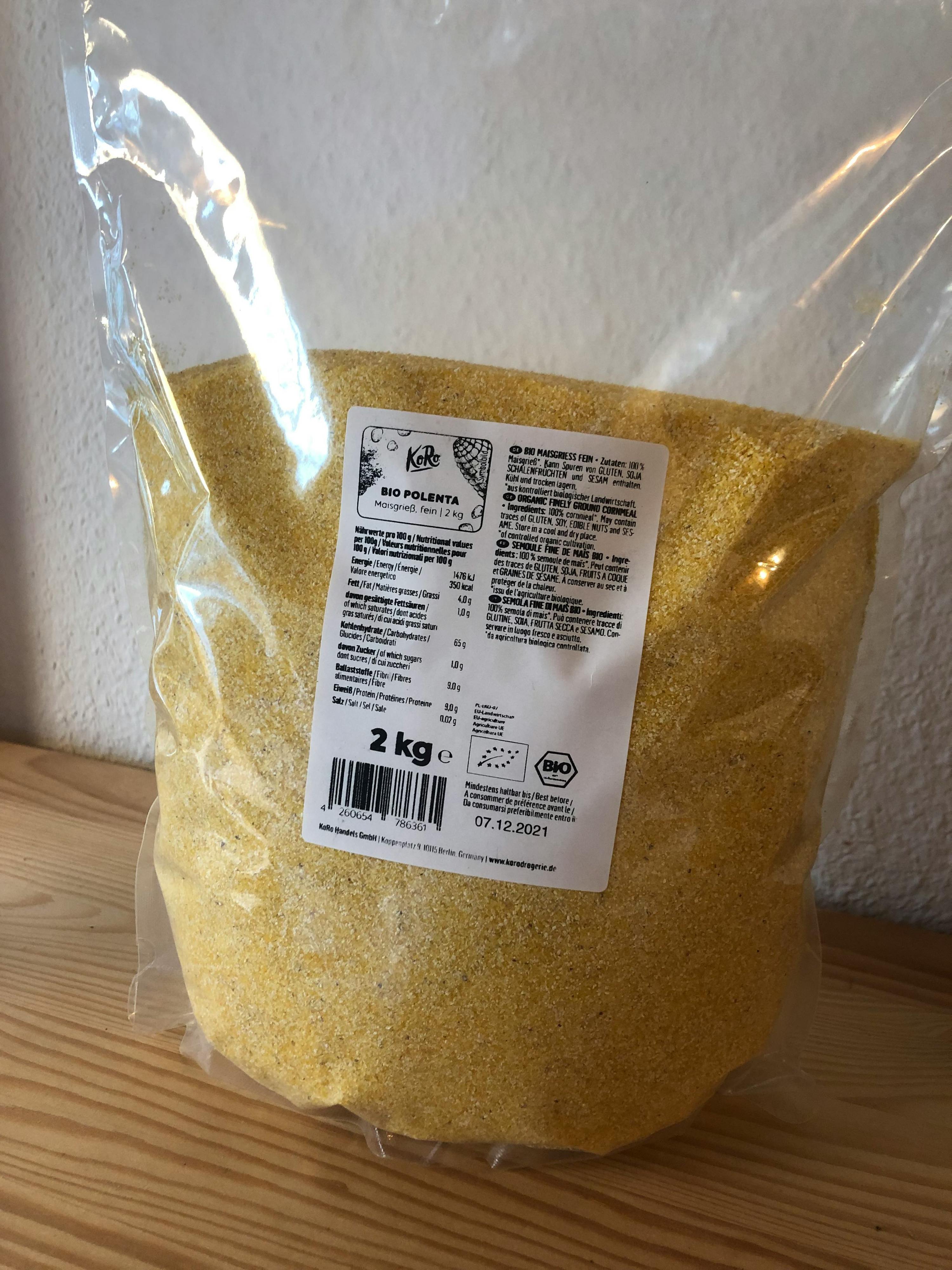 a bag of polenta is sitting on a wooden table