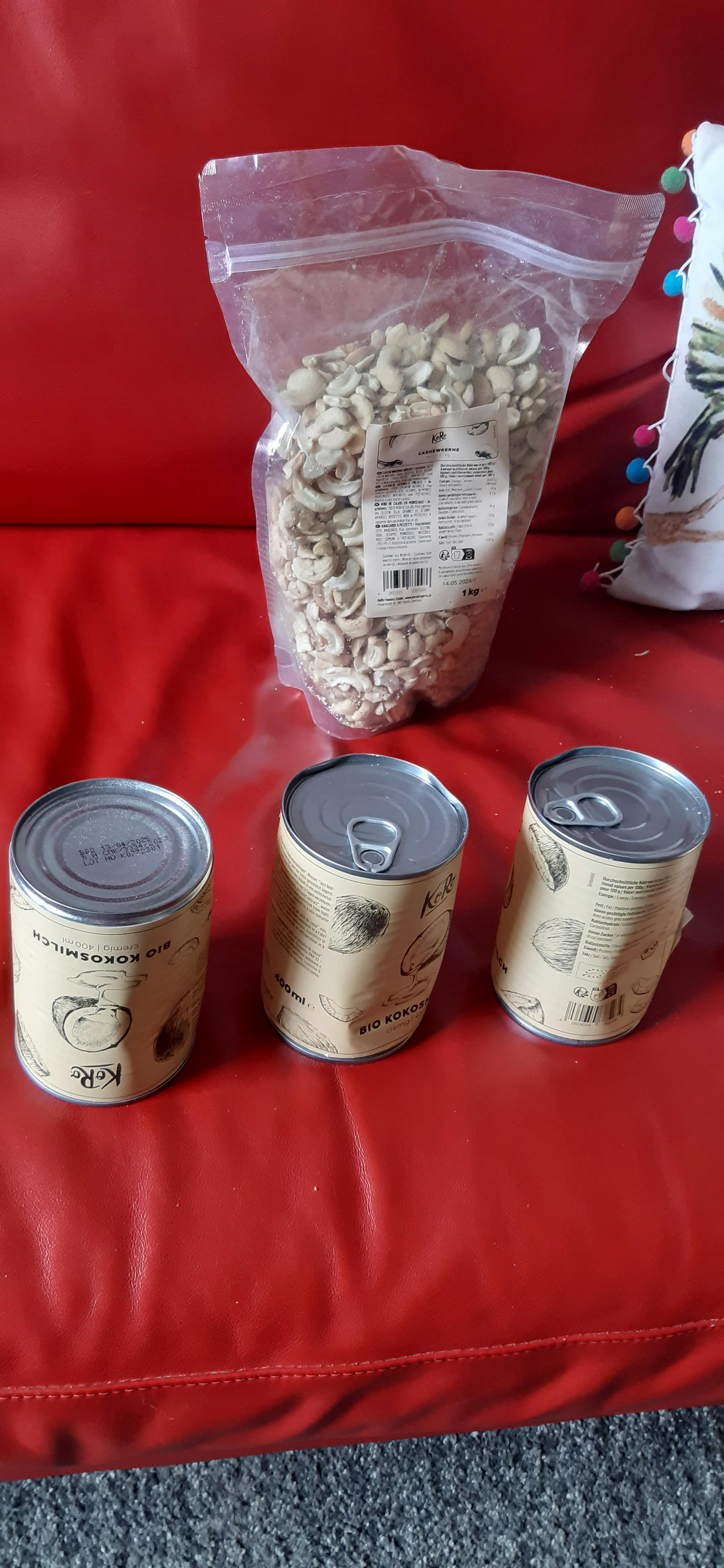 a bag of white beans sits next to three cans of mushrooms