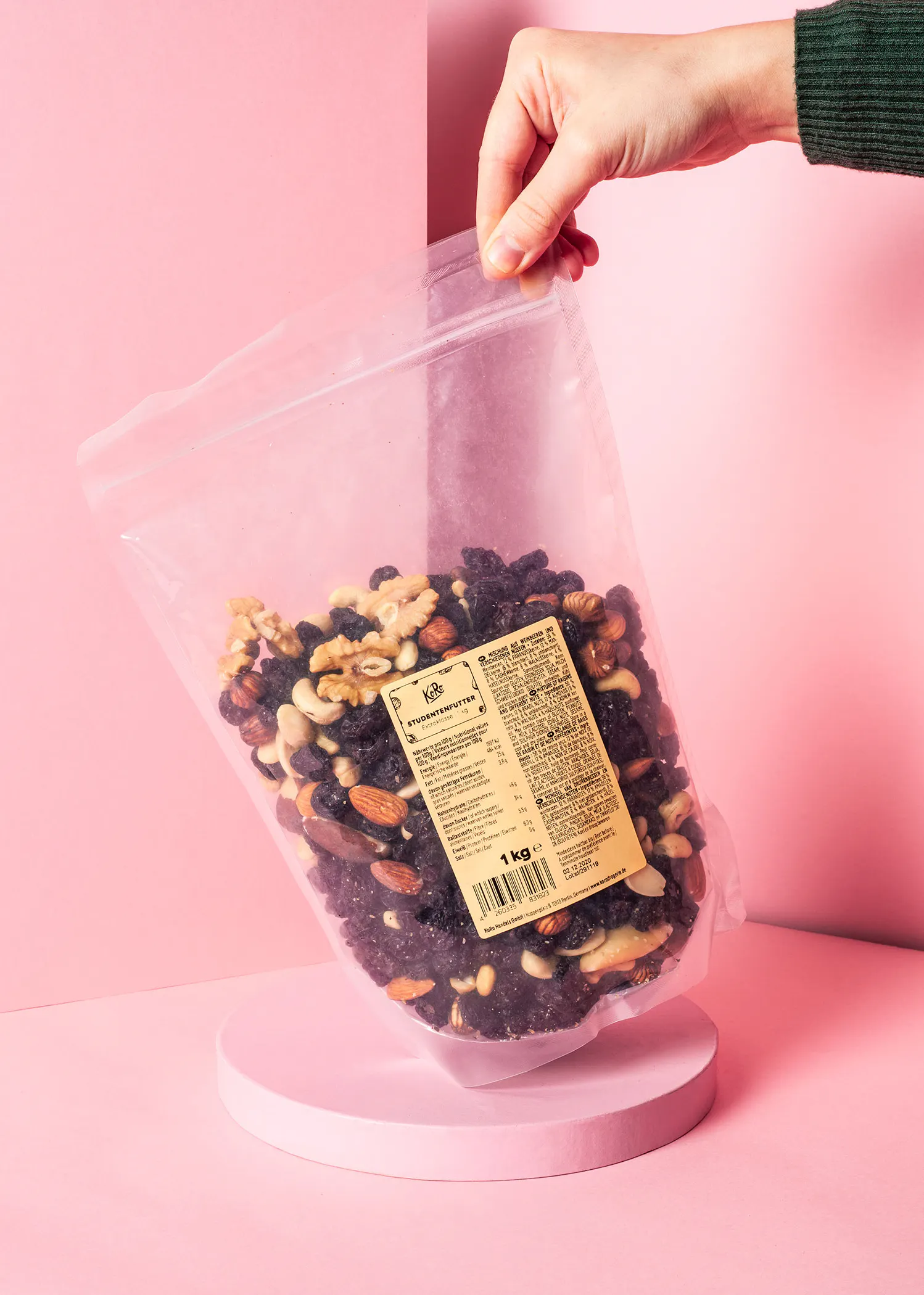 a person is holding a bag of nuts that says kids