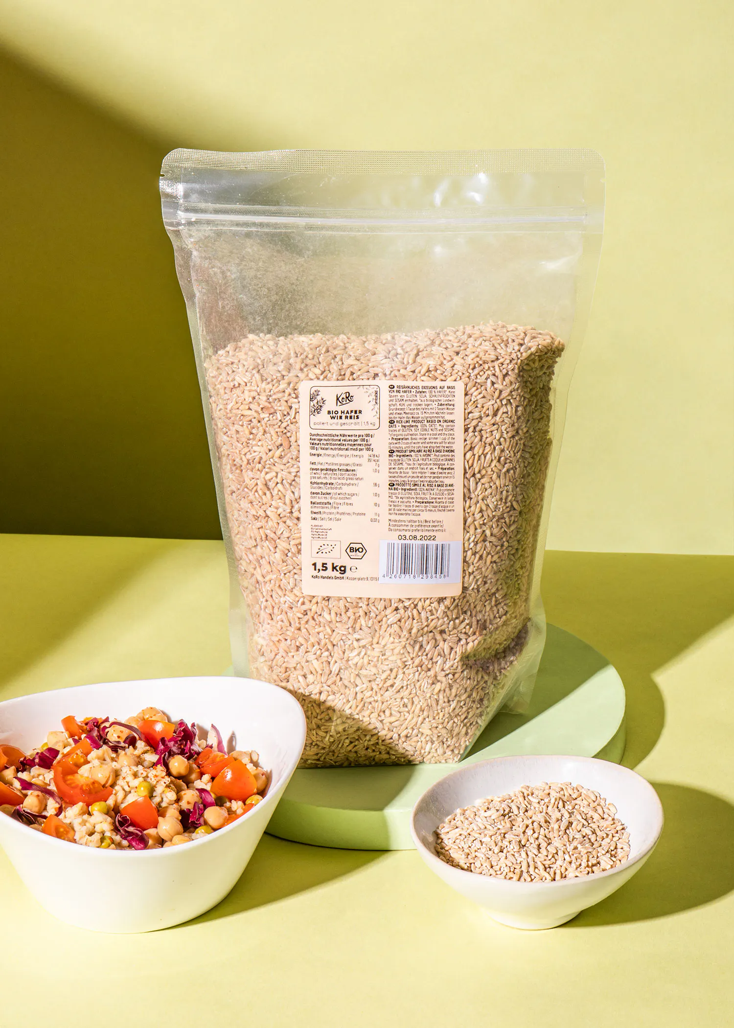 a bag of rice sits next to a bowl of rice