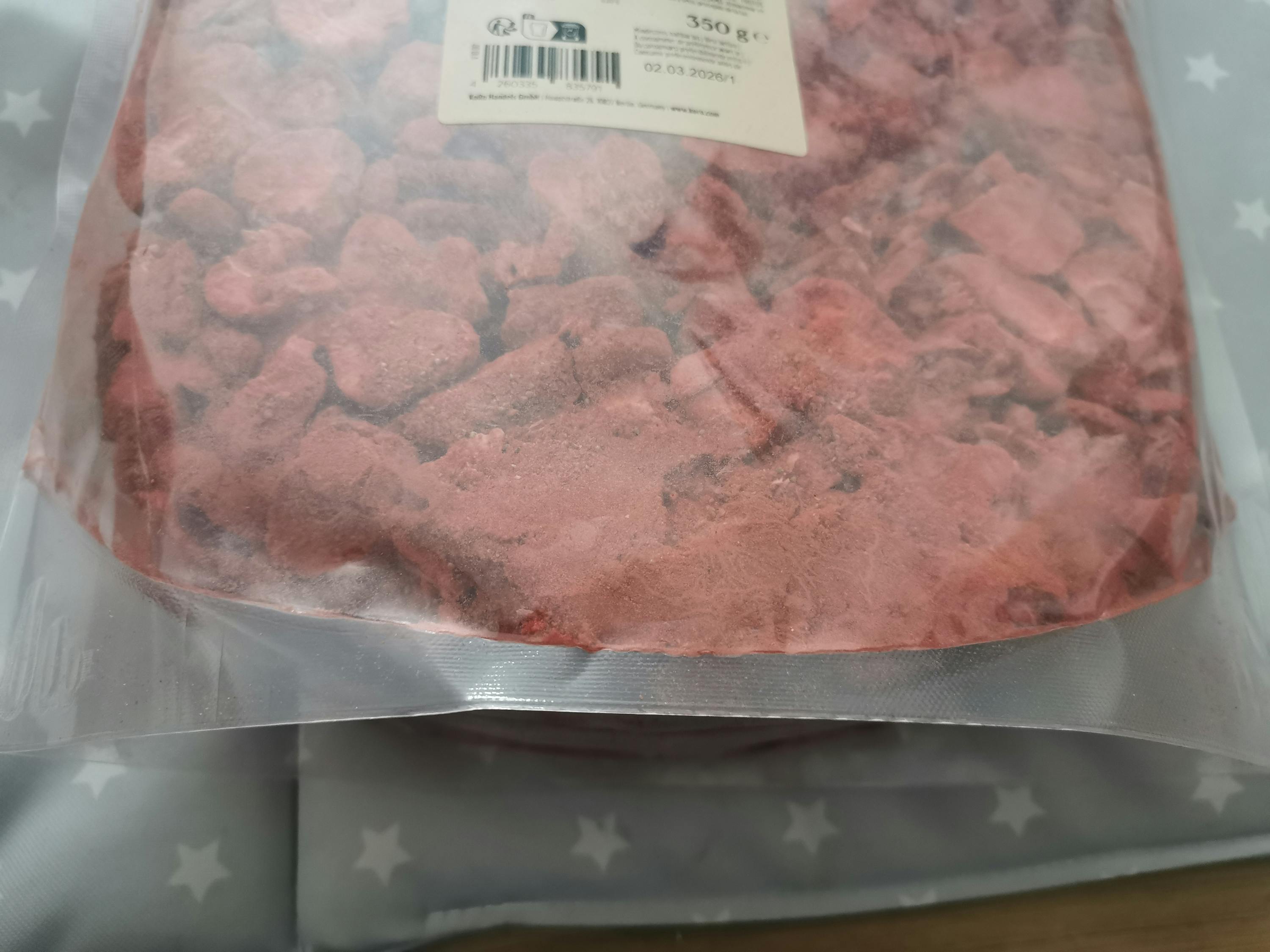 a bag of red rocks with a label that says 350 g on it