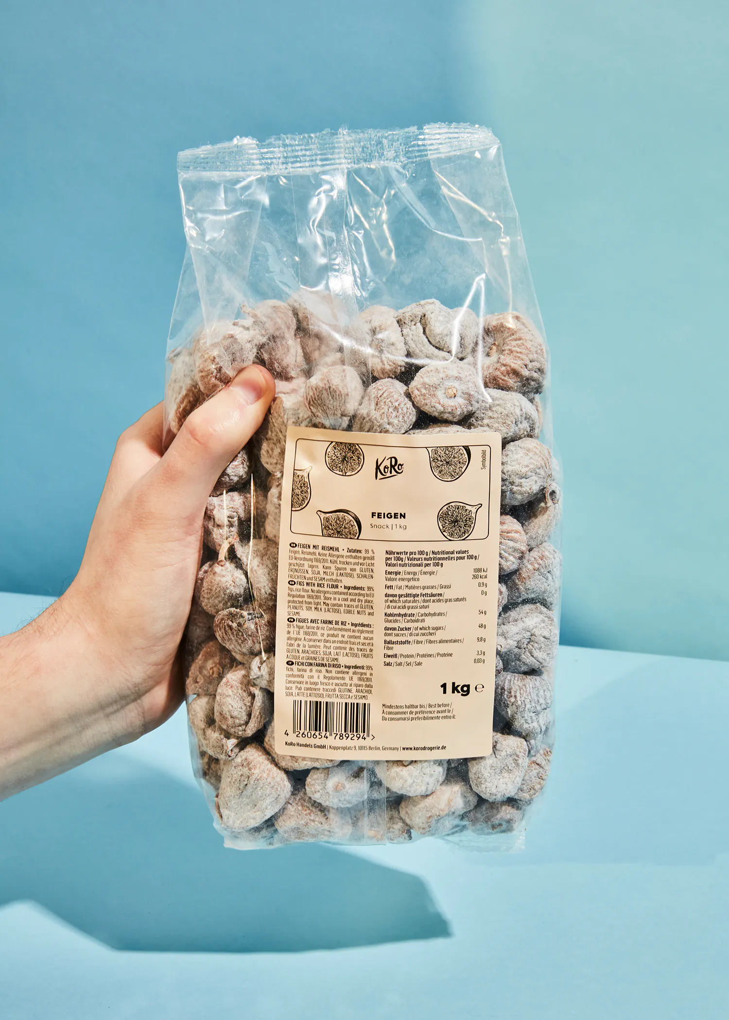 a person is holding a bag of feigen nuts