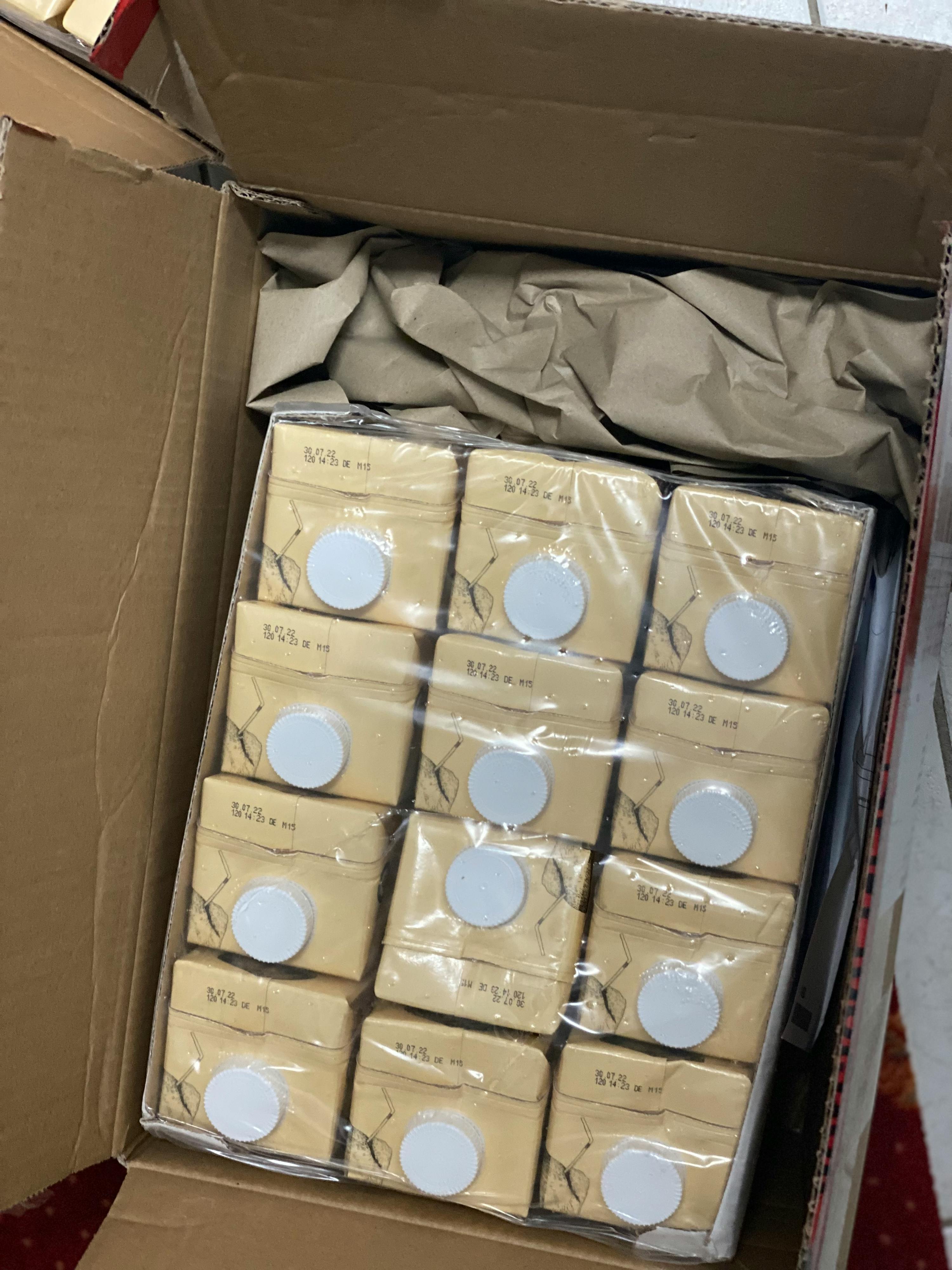 a cardboard box filled with a lot of boxes that say ' vanilla ' on them