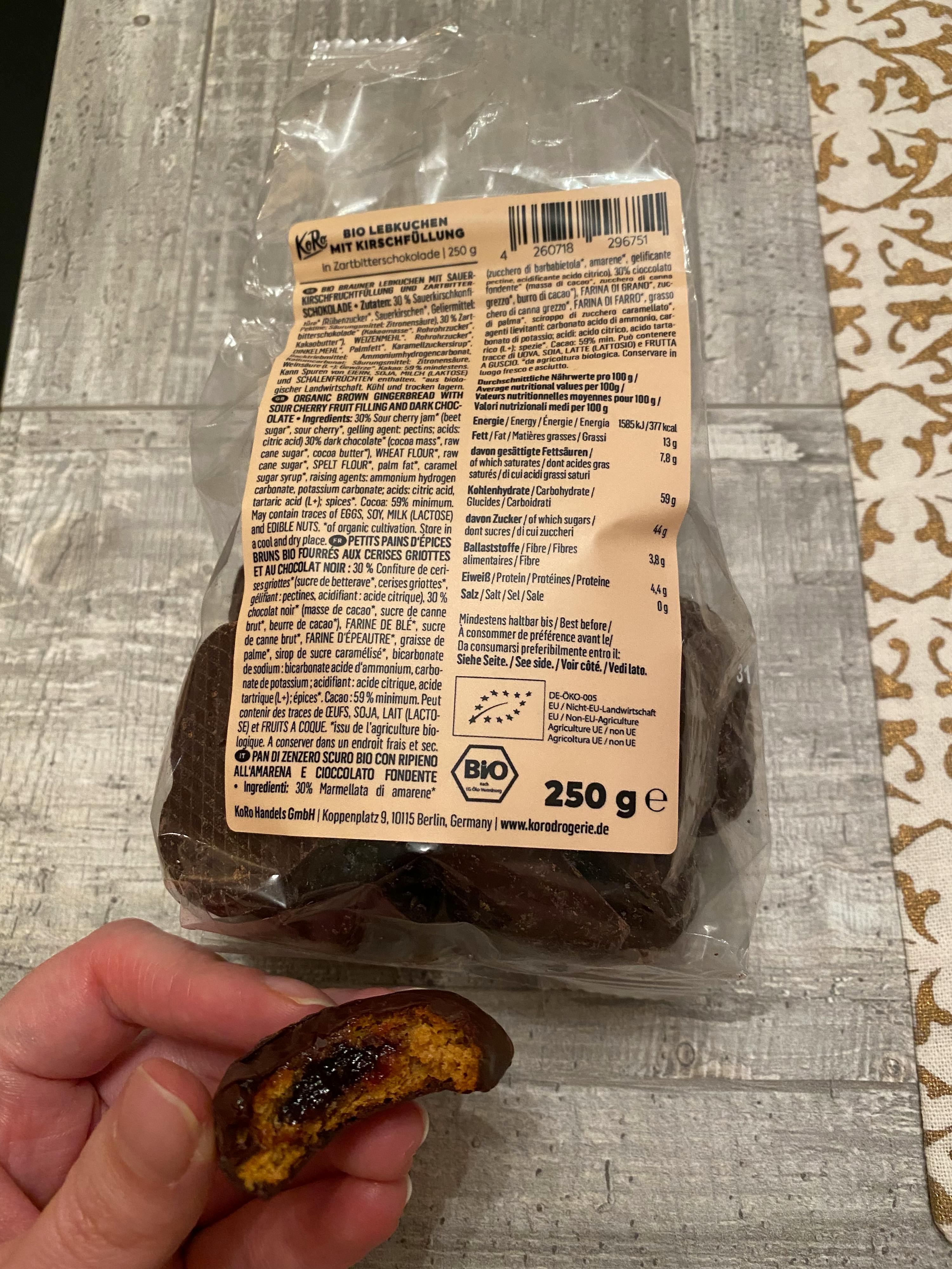 a person is holding a package of bio cookies