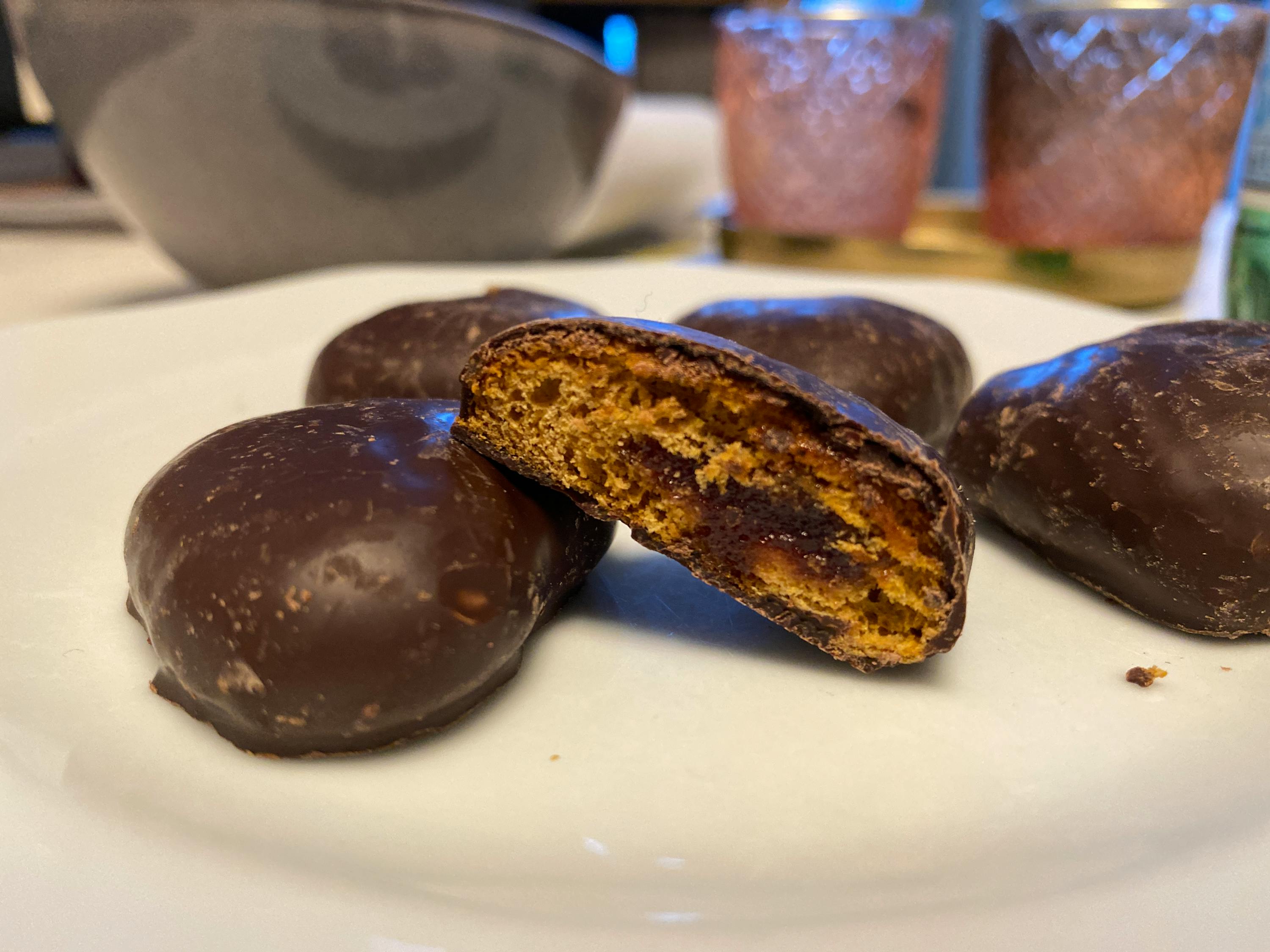 a chocolate covered cookie with a bite taken out of it