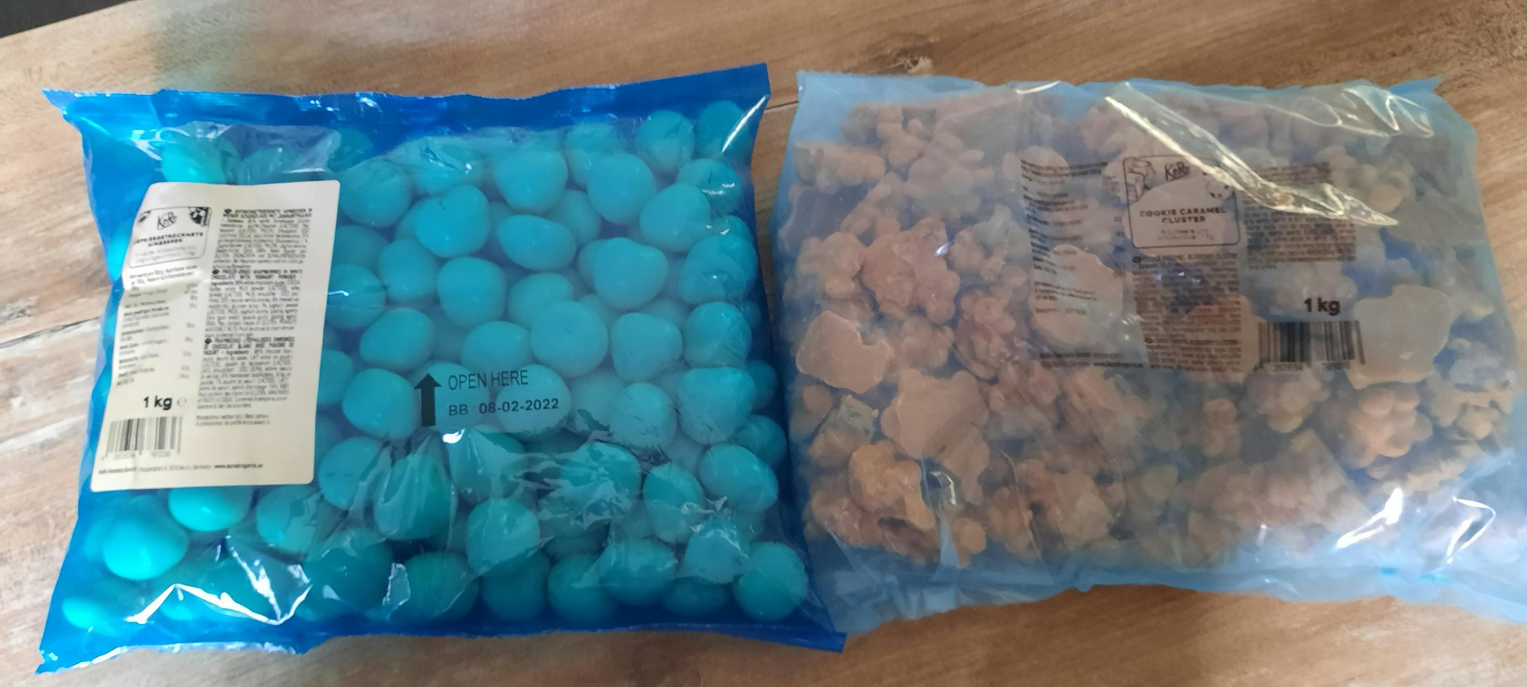 two bags of candy one of which has a date of 02/02/2022