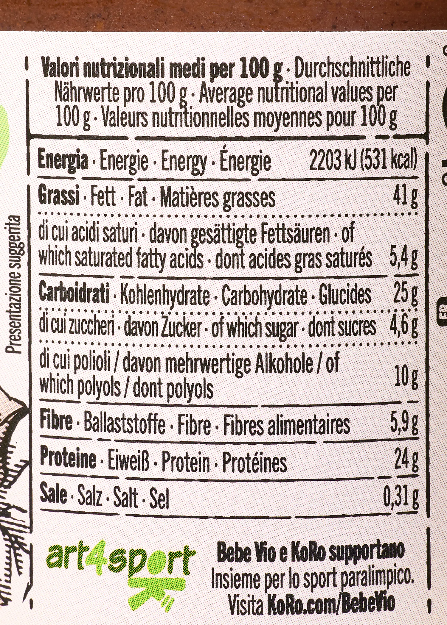 etichetta nutrizionale che elenca i valori medi per 100g in più lingue, tra cui energia, grassi, carboidrati, fibre, proteine e sale, con un messaggio di sponsorizzazione per lo sport paralimpico in fondo.