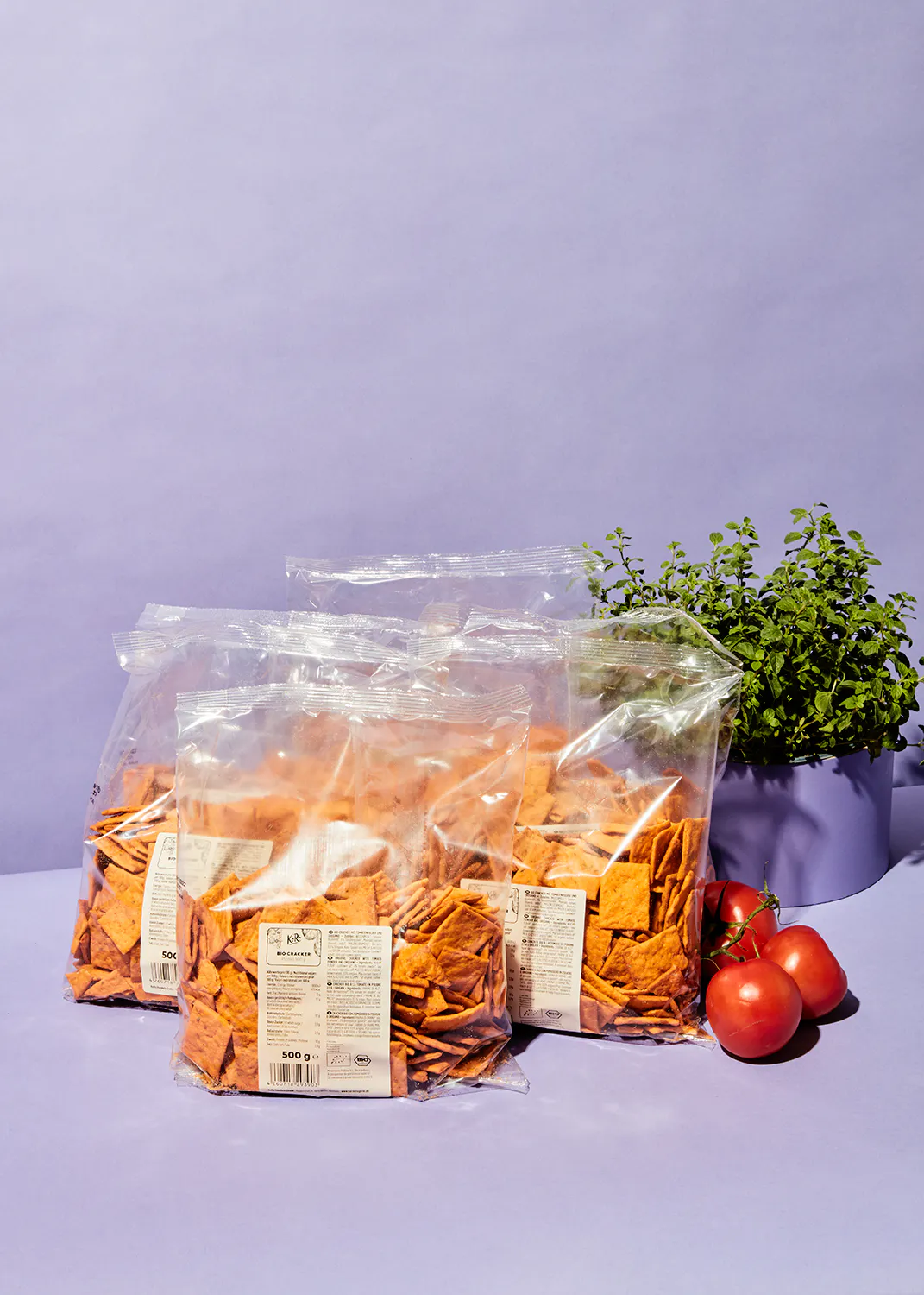three bags of tortilla chips are sitting on a table